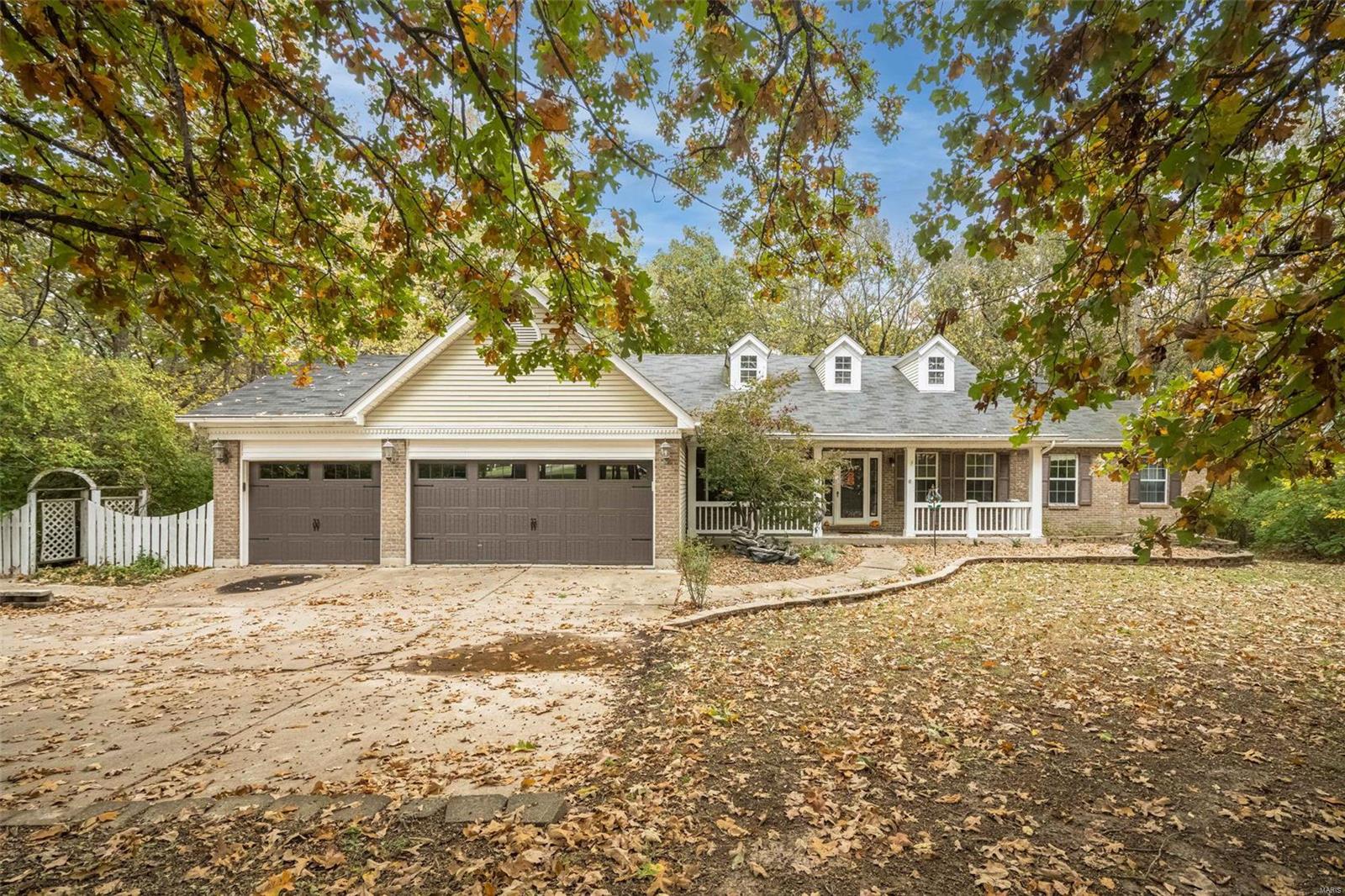 This is the one! Huge true 4-bedroom Ranch Home that has acreage, completely private with a 3-car garage. This 4 Bedroom 3 Full Bath home has well over 3500 square feet of living space with a fantastic split bedroom floor plan. The open concept floor plan opens to the updated kitchen that features 42” custom cabinetry, granite counters, tile flooring and stainless gas range and black appliances. Opens to the massive great room with full brick fireplace. Soaring vaults and perfect access to the huge backyard with all the privacy you can ask for. The master retreat features a sunroom with access to the deck that’s amazing for morning relax or just additional living space. Luxury master bath offers dual vanities, separate tub and shower, tile flooring and easy access to laundry. The other wing of the home supplies the other 3 bedrooms and a full bath. The partially finished basement adds tons of living space and storage. All this in a highly desired neighborhood right outside of town.