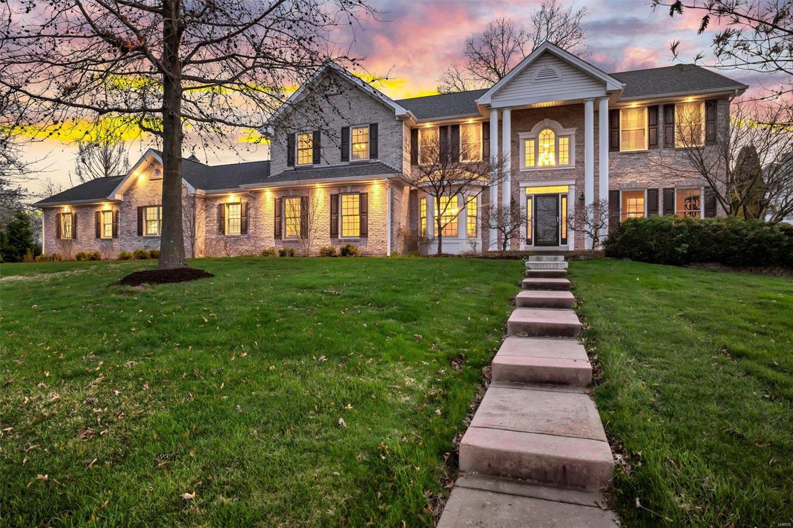 This breathtaking 5 bed 5 bath is in the Lindbergh School District & boasts functional beauty at every turn! A 2-story foyer welcomes you w/ wood floors leading to the dining room w/ a bay window. Through the family room, sunlight illuminates the living room w/ a stone fireplace. The eat-in kitchen offers abundant cabinetry, a custom wet bar & a disguised subzero fridge. A great room hosts built-ins w/ 2 fridges for elevated convenience & a laundry room, office & full bath complete the main floor. Atop the double staircase, a common area invites you to convene. 4 bedrooms line the hall including a vast master suite w/ 2 walk-in closets, 2 sinks & a separate tub/shower. A Jack & Jill bath joins 2 rooms w/ another full bath in the hall. The LL has a large rec space, kitchenette & full bath w/a dual Hollywood-style vanity. The outdoor area has a spacious covered patio w/ ceiling fans & a grill station walking out to a 2nd patio. A 3-car garage & sizeable yard are the cherries on top.