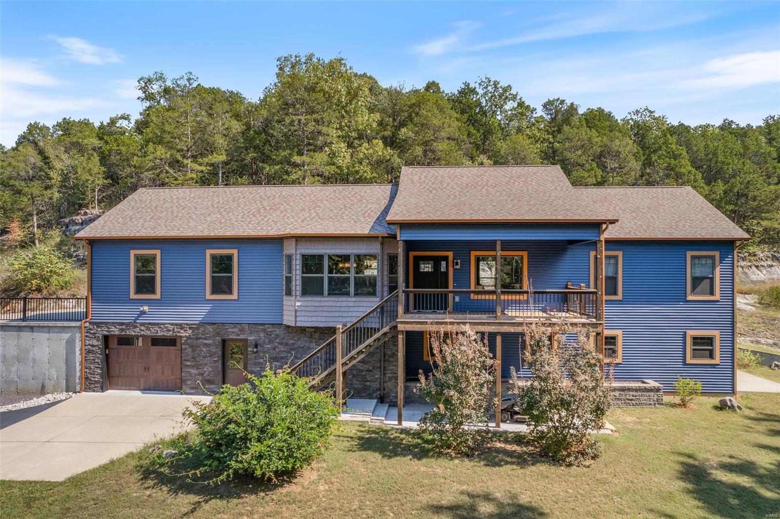 Super nice custom ranch built in 2017 sitting on a beautiful2 acres featuring unique rock formations&2 wet weather waterfalls on a secluded cul-de-sac. Covered deck with patio below & a 2nd patio in the back. Copper colored gutters & downspouts with a 40 year architectural shingle. 2 car garage with a 1 car underneath that has a wash sink & access to the basement. Open Floor plan,kitchen with center island,custom concrete tops on perimeter&granite/wood tops on the island.Soft close doors&drawers through out the house. Black stainless steel appliances that stay.Cathedral/vaulted ceilings in the Living room with 9ft.ceilings on the rest of upper level. 9ft.foundation with some drop ceilings in the lower bedroom & bathroom.Main floor laundry that connects to the master walk in closet&master bathroom for convenience.5x5 custom master shower with sprayer handle,rain head&a bench seat.His&hers vanities & private toilet room.This Home shows like new!R-7 schools.Close access to I-55 & Hwy 61.