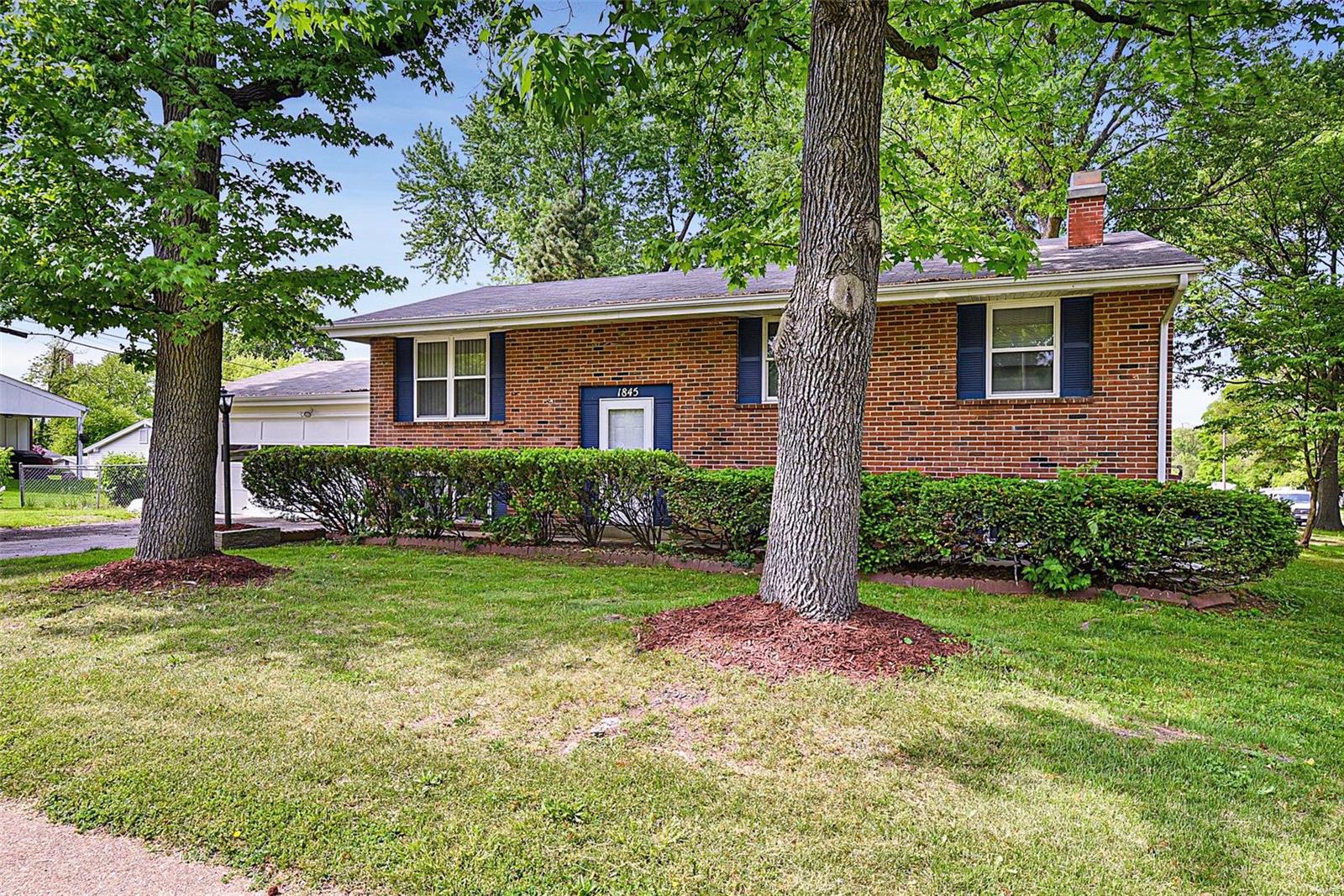 Welcome home to this BEAUTIFUL 4 bdrm, 2 full bath, corner lot w/ 2 car garage!   This split level home has beautiful refinished hardwood flooring, new coat of paint throughout, all new doors including closet doors, all new light fixtures, new carpeting in 2 lower level rooms, a ONE year old roof & a central vac.  Kitchen boasts of stainless steel appliances including GAS stove, SUBWAY TILE backsplash, pantry and TILE flooring. Nice size living room, dining room, 3 bdrm, 1 full bath, coat closet & linen closet completes the main level. Lower level has great room w/ BRICK FIREPLACE, 1 bedroom, 1 BONUS room & 1 full bathroom w/ GORGEOUS tiled stand alone shower!  Walk out from the sliding glass door from your dining room to your fenced-in backyard, RELAX and enjoy the HOT TUB year round! Hurry and make your appointment NOW!