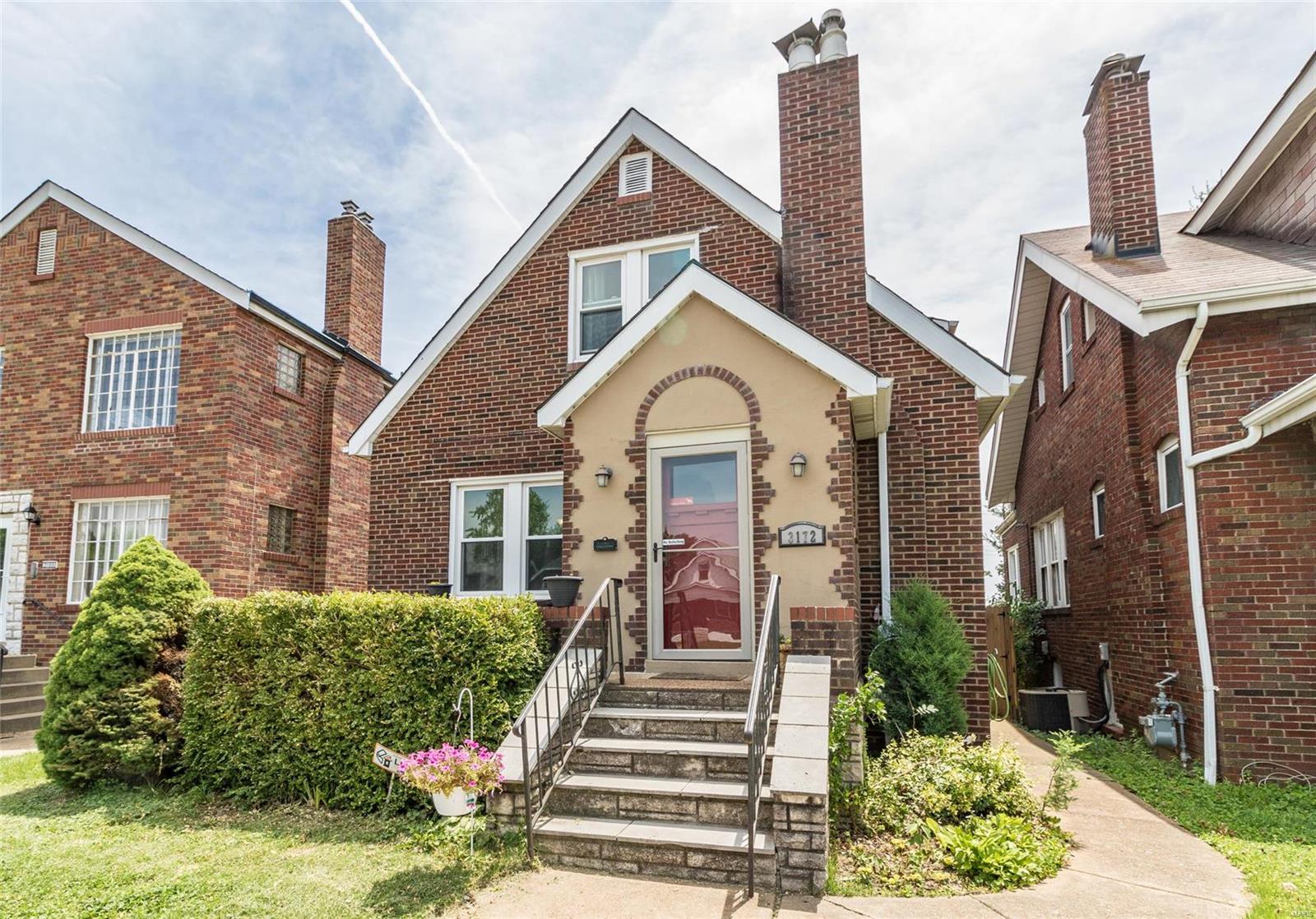 Absolutely cute and one of a kind front elevation with period architecture and cozy front porch. Well cared for and tidy home has high 1st floor ceilings, beautiful focal point facade fireplace in living room, original hardwood floors, classic original wood doors and hardware. Some newer Certain Teed windows installed, newer furnace and A/C. Main floor bedroom with lots of natural light. Large upstairs bedroom with oversize closet and third bedroom up. Full basement with walk out/walk up, extra storage under front porch in bsmt. Also bsmt. half bath. Updated service panel with breakers, half bath also in L/L. One car garage with newer door and opener. Nice patio area next to garage. This a super neighborhood (Lindenwood Park) near shops and great restaurants on "The Hill" Convenient to highways and the great city amenities.