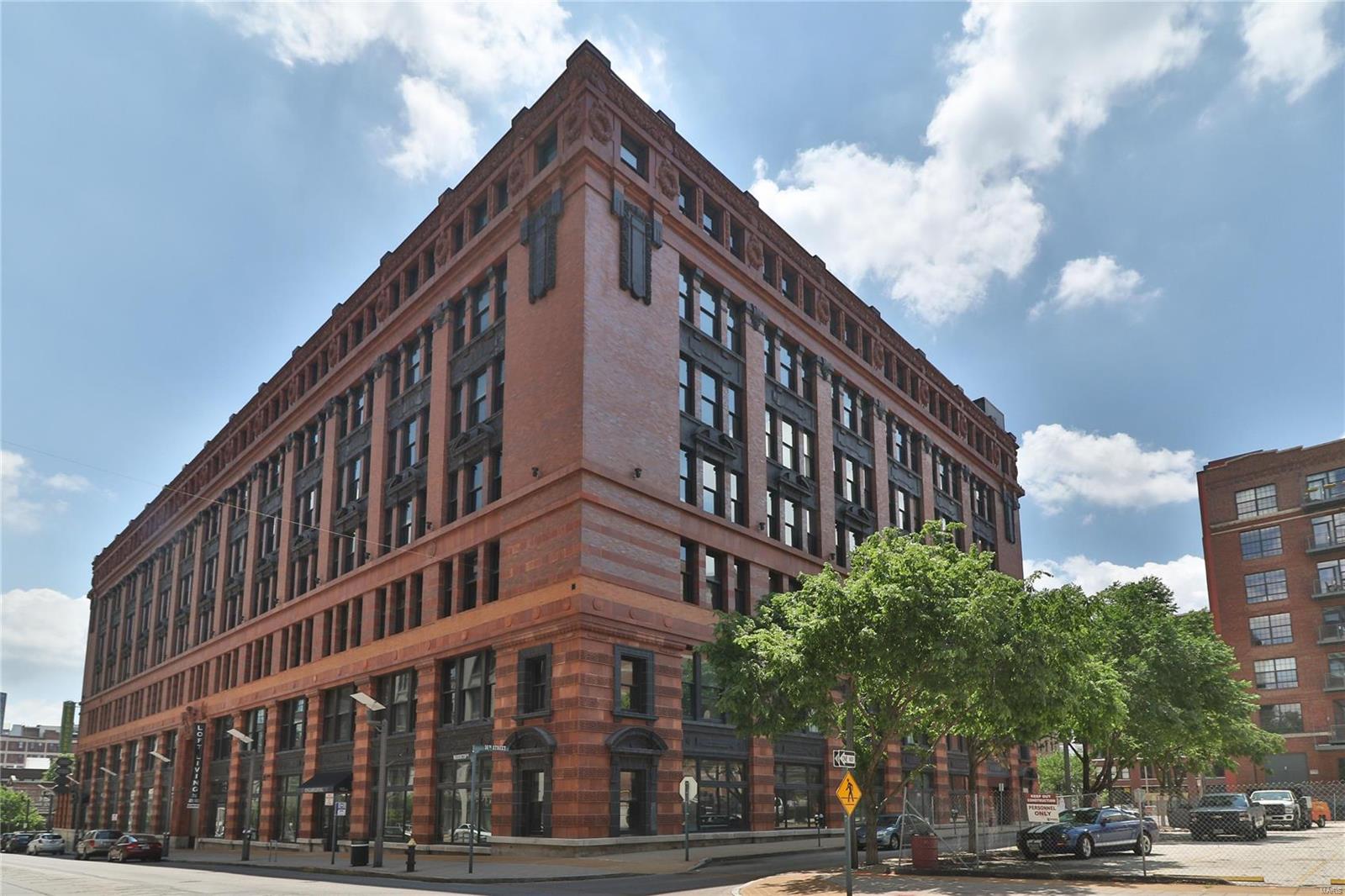 This Ely Walker unit features high ceilings, beautiful hardwood floors, exposed brick, and open ductwork, offering modern style and convenience. Open floor plan, with tons of flexible living space, has plenty of room for Kitchen, dining, and Living area. Master Bedroom, additional bedroom, full hallway bath, and laundry room complete this incredibly spacious unit. Enjoy all of the fabulous amenities the Ely Walker has to offer including 1 parking space in the Terra Cotta Garage (space #224), storage unit #213, community clubhouse, gym, and rooftop patio with BBQ grills, perfect for entertaining this summer! Great investment opportunity within close proximity to all downtown has to offer! Location: Downtown