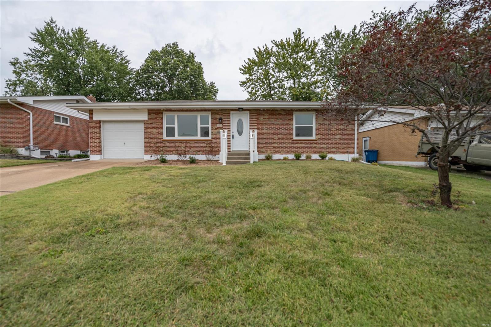 Recently updated ranch in nice subdivision.  Large addition off dining room with fireplace.  Newer kitchen with stainless appliances and vinyl plank flooring.  Updated bath.  Just refinished hardwood floors.  White six panel doors and trim. One car garage.  Full, partially finished basement with family room with newer carpeting.  Freshly painted throughout.  Low maintenance exterior.  Already passed St. Louis County Inspection.  Nothing to do here but move in.  Owner/Agent.