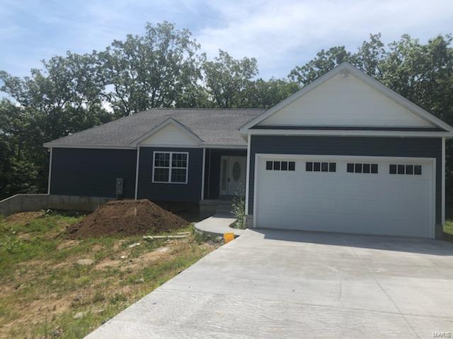 New construction is almost ready to be your new home! +/- Walk into this 1750 sq ft 3 bed, 3 bath ranch with 9x8 entry foyer leading into spacious open concept large living room with vaulted ceiling, breakfast room, custom kitchen with walk in pantry and granite counters.  Showcases master suite with jetted soaker tub, sep. tiled shower, granite topped dbl sinks, and his/her closets.  Also featured main floor laundry, lg sep dining room could easily be 4th bedroom or office, covered front porch and large deck of back.  Open staircase leads to huge drywalled 58x13 room, full bath, walkout and oversized tuck under 1 car garage in addition to the 2 car attached.  This home will not disappoint! You are in town close to everything you need but has privacy feel with backing to trees.  Easy walk to Bonne Terre Pond for picnic and fishing.  Call today to make this great home your dream home!
Disclaimer: Measurements performed by non qualified persons, buyer to satisfy self with measurements