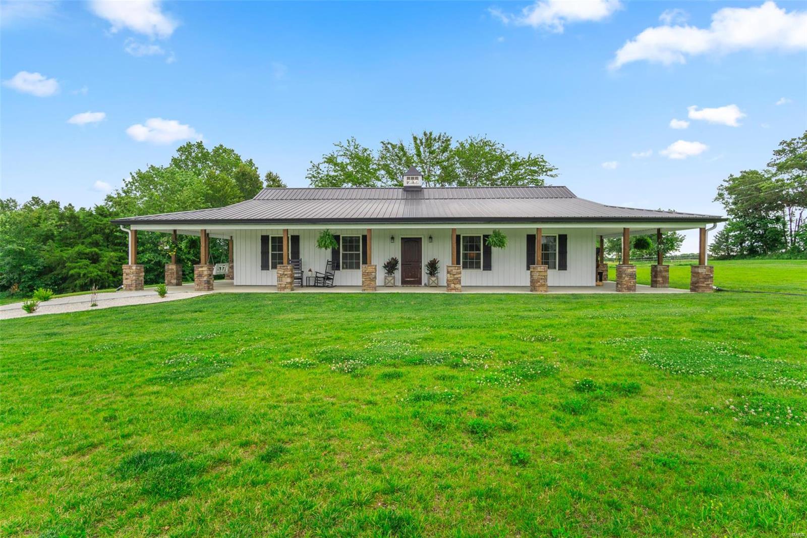 If you had a check list for a small country setting nestled on 6 acres, you have found it! This like new home is absolutely stunning! 1500 square foot of the modern farm house feel with 3 bedrooms, 2 full baths and a wrap around front porch with a spectacular view. Fully Fenced Property, Outdoor Riding Arena, and a Horse Barn that even the horses are amazed! If horses aren't for you, the barn can easily be converted to shed or pole barn for all the equipment or toys you need.. Handmade Custom Kitchen Cabinets, Copper Farmhouse Sink, Walk-in Master Closet, Soaker Tub and Double Sinks in the Master Bath, and Vinyl Plank Flooring. The home is wood framed and is not technically a "Shouse." Property will qualify form multiple types of Loans. As you can see, no detail has been left unfinished. This home was designed for the Chip and Joann farmhouse style. Definitely don't want to miss this one!