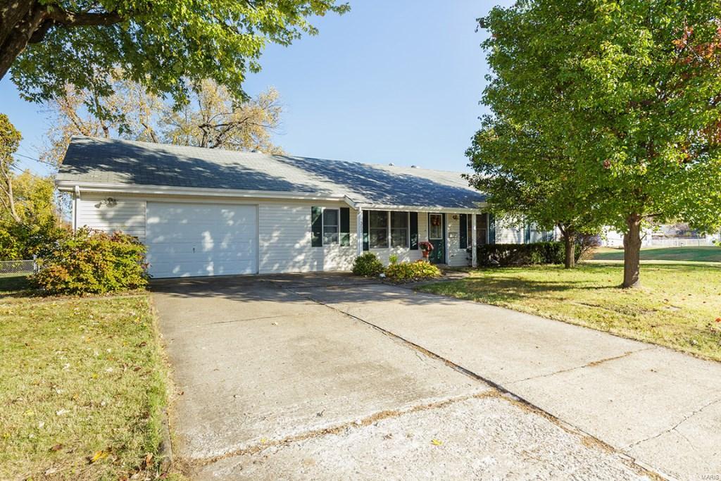 What’s not to love? This charming 3 bedroom, 1.5 bath home has been well maintained and is in a fantastic O Fallon location.  Enjoy nearby Civic Park, Alligators Creek Aquatic Center, T.R. Hughes Ballpark and the many restaurants, shops and services Main Street and Highway K in O Fallon.  Features include 1100 square feet of living space, an oversized 1 car garage (17 ft wide x 24 ft deep), added garage storage (8 ft X 11 ft), service door from the garage to a patio, low maintenance vinyl siding, enclosed fascia-soffits, decorative front door, a large Living-Family Room, eat in Kitchen with lots of cabinets, smooth top stove, microwave, dishwasher, a 10 X 18 screened in porch, patio, a fenced in yard and a corner lot.  Enjoy easy access to Highway 70 and a short commute to Mid Rivers Mall Drive and Highway 370.  Great home, fantastic location, priced to sell…check it out today!
