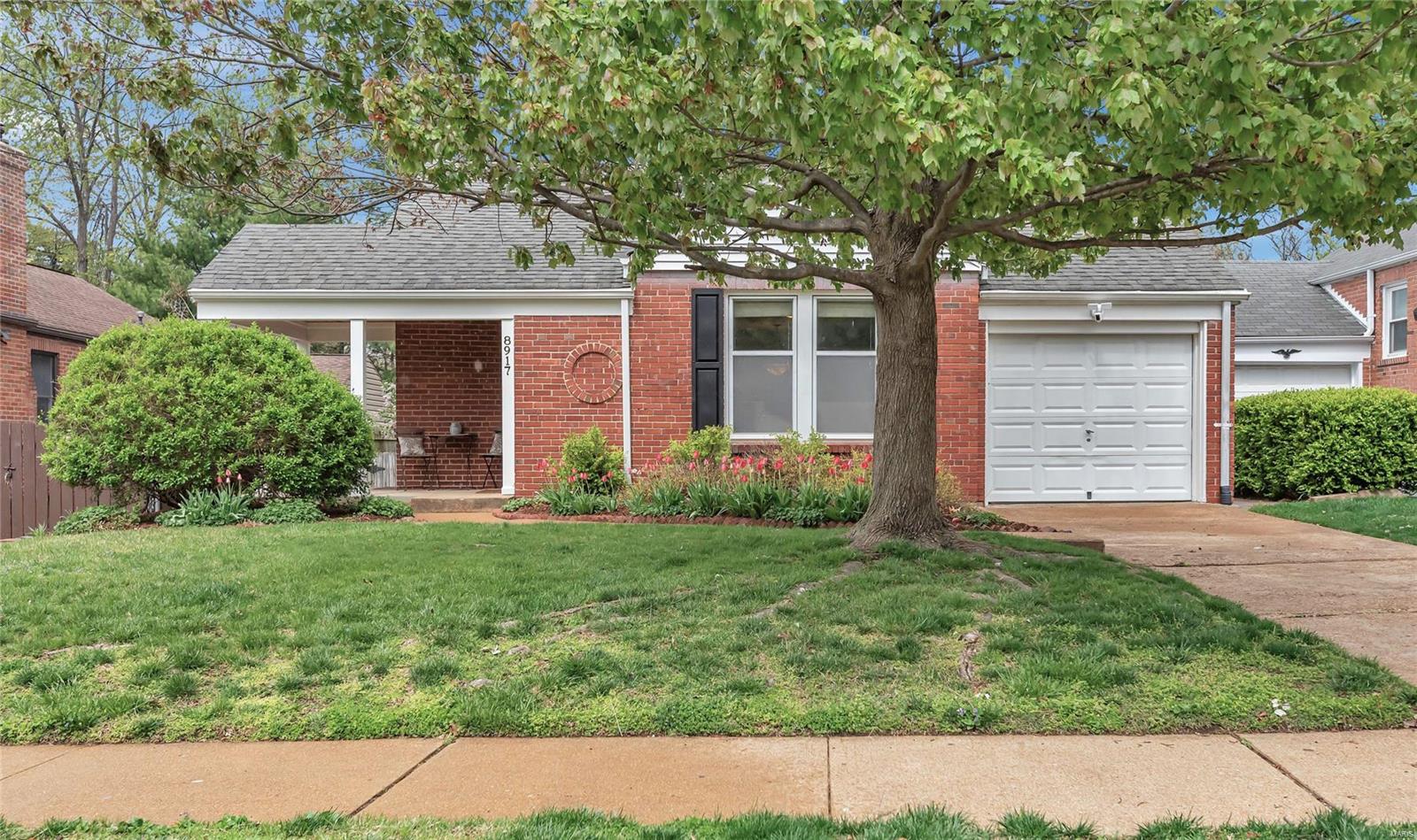 Nestled in a walkable Brentwood enclave, this super-cute, brick ranch accommodates you with 3 bedrooms and a lower level sleeping area, 2 full bathrooms and a one vehicle attached garage. Enter through a covered front porch to lovely hardwood floors, hearth living room/dining room with fireplace and cased windows. Upgraded kitchen includes solid surface countertops, stainless appliances, can lighting and porcelain tile flooring. Generous 24x12 deck spills into level, fenced backyard where gardening possibilities abound. Lower level is partially finished with spa-like bathroom and large family room/media room. Lower level also contains laundry room and abundant storage. Passed Brentwood Occupancy makes this home move-in ready. Quick access to local retail and central arteries I-64/40 and Brentwood Blvd, top-rated Brentwood schools! Brentwood MO, recently named #1 Best Places to Live by Niche.