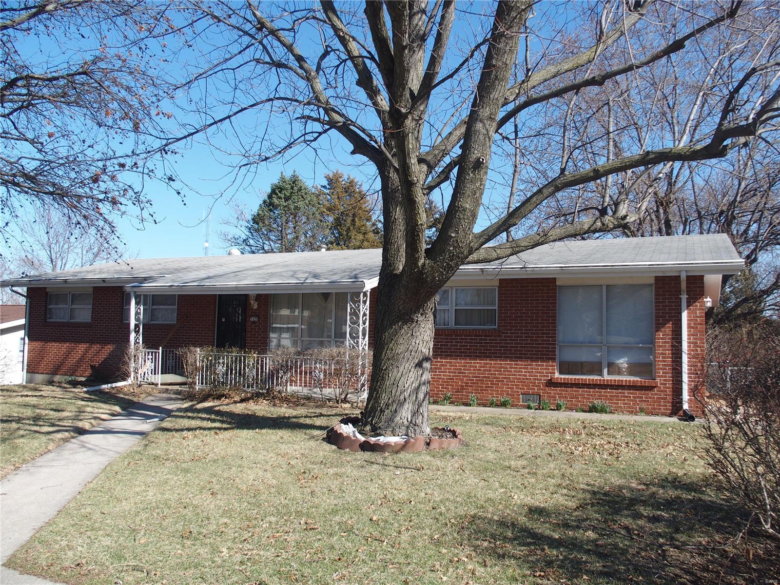 All brick ranch home in prime location!  Just 2 minutes to I-70 or I-364 (Page).  Main home has 3 bedrooms & 3 baths (1 full & 2 half-baths), the attached "apartment" has a kitchen, full bath, bedroom, living room & separate entrance.  The "apartment" is perfect for mother-in-law space, teen suite or rental potential.  Giant patio in level, fenced backyard, backs to trees for privacy.  Newer roof and HVAC systems in the apartment.  Huge garage and family room in finished lower level.  Great opportunity for investor, just needs some TLC.  Home being offered "as is", seller to do no repairs or inspections.
