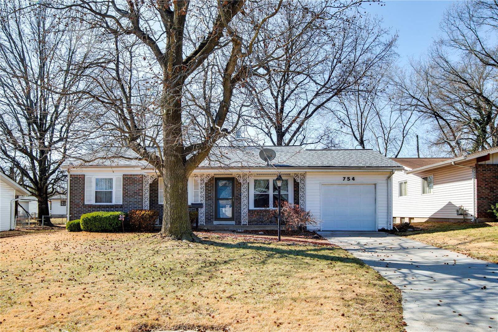 Showings start 3/1 !  MOVE-IN READY ! This adorable ranch home is exactly what you are looking for! 3 bdrm/2 FULL bath with attached 1 car garage. Wood flooring! The open floorplan has a beautiful two sided, wood-burning fireplace as a focal point that leads into the family/dining room. Master bedroom has an en-suite that has been recently updated. Newer Windows and flooring. Kitchen is updated and beautiful!!  New patio doors leads out to a breezy screened in porch that overlooks the flat and fenced backyard ! This can be your new home !
