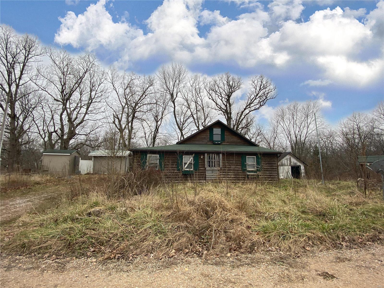 LOOKING FOR A WEEKEND GETAWAY???  This unique property is a cabin located directly on the river with a wonderful view of the Gasconade River, close to what locals know as the Brownfield area. The cabin needs some TLC and has been vacant for a extended amount of time.  Therefore all utilities and such are not disclosed and is being sold “AS IS”.  The location of the property is within walking distance from the Anna Adams access which is approximately 400 feet. Multiple outbuildings / sheds.