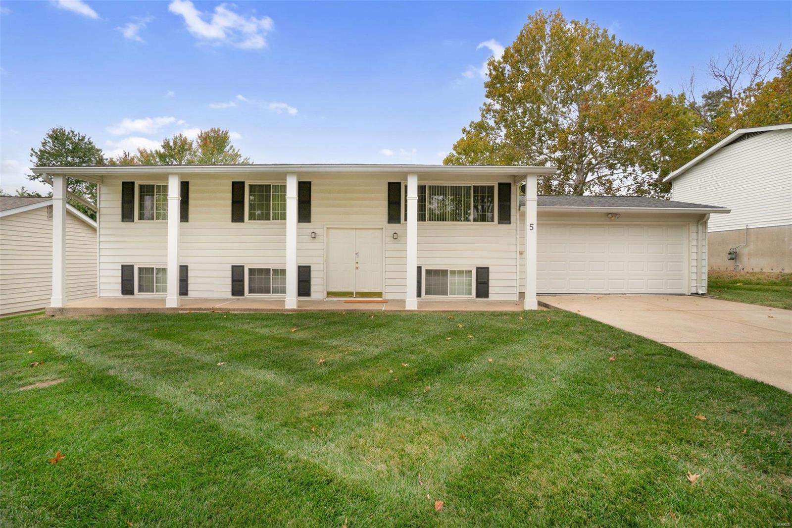 First showings are on Friday 10/20/23 at 3 pm.  Welcome to 5 Martin Lane!  This 4 bed 2 bath home has been meticulously cared for and is ready for its new owners!  It features new, neutral paint throughout, new or refinished floors, newer bathroom fixtures and beautiful white kitchen cabinets.  All appliances, including the washer and dryer, can stay!  Step outside onto your composite deck and overlook your spacious, fenced, luscious green yard that has been maintained by True Green Lawn.  Start grilling or put your smoker on your huge backyard patio.  Did I mention there's no HOA?  The owners have spent the past 10 months making this home shine!  All that it needs now is YOU!