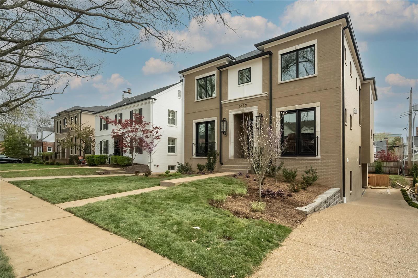 This spectacular new 2-story construction by DeBrecht Homes is located just a block from the vibrant Clayton area. The open floor plan features 10' ceilings, elevator, stunning moldings, exquisite finishes, and elegant ceiling accents, creating a spacious and luxurious feel. The family room's large windows and cozy fireplace lead to a chef's kitchen w/ high-end appliances, walk-in pantry, and butler's pantry w/ a beverage fridge. The home office w/ its fireplace, walnut custom shelving, along w/ the dining room's custom millwork, are perfect for stylish entertaining and working. The primary suite boasts a coffered ceiling, large walk-in custom closets, coffee bar, and luxurious spa bathroom with beautiful walnut vanities, tile work and free-standing soaking tub. Three more bedrooms, each w/ private baths and custom closets, complete the upper level. The lower level provides a large rec room, bathroom, and extra bedroom/office. This amazing new construction will be available April 2024.