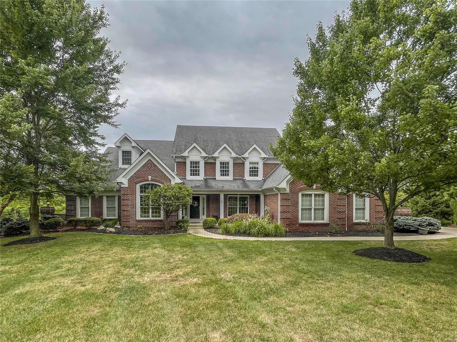 DeShetler built custom predominately brick home on one acre+ - inground pebbletec Baker pool, backing to woods, completely redone and very much today with color and design - 2-Story entry and great room - with library - custom millwork and shelving with french doors for an at home office - large dining room with wood floors in greatroom, kitchen hearth room and dining room - lush pale carpet in bedrooms and lower level - 5 bedrooms - with two additional rooms for craft work and another for exercise - separate rec room in ll - with wet bar and fireplace - actually 3 fireplaces - greatroom, hearthroom and recroom - top quality counters in white with marbeling of gray - impervious to stain - ample closet space - a t-staircase from entry and kitchen area for the family use - upper level is 3 large bedrooms and 2 baths - master has separate shower and free standing tub really large enough to relax in - newer driveway and front walk with custom concrete to appear as stone - Ample storage