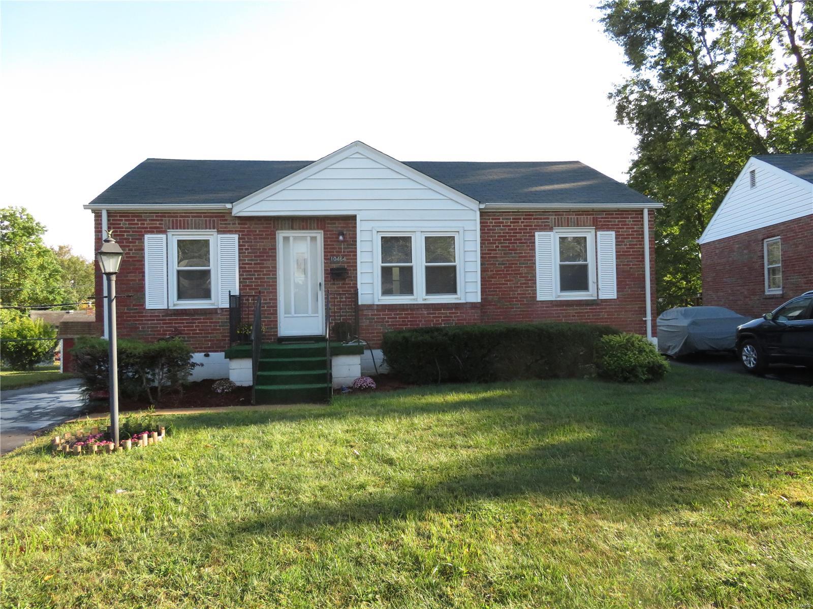 2 bedroom brick ranch with oversized 2 car detached garage with workshop AND electric!! Hardwood floors under new carpet (installed 9/28/20), vinyl tilt in windows, custom tile backsplash and newer counters. All appliances stay as is including refrigerator &  dryer. Clean and very well maintained - don't miss this one!