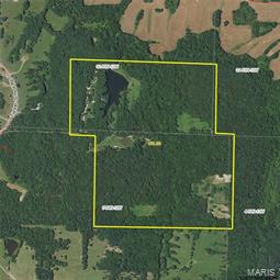 20 minutes north of Columbia City limits; The 1 ½ story house is set on a crystal clear 5 ½ acre stocked lake. Surrounding the home with 180 degrees views of water. You also see pristine shorelines, mature timber, warm season grass and all kinds of wildlife, The house is an open floor plan, 3 BR, 2 ½ BA, oak lap siding that you can’t drive a nail into and the oak timbers are from the property. Full stone masonry fireplace, Anderson windows and doors, insulated with stress skins panels for maximum insulation, high speed internet and supplemental wood furnace, Ultimate Recreational property, mostly mature hardwoods with established food plots surrounded by 4 large farms create some of the best trophy whitetail deer and turkey hunting in the area. The 5 ½ acres lake is deep, clear and stocked with bass, bluegill, crappie and catfish. The timber is primarily mature oak that has not been harvested for years, The property is easily subdivided in half.