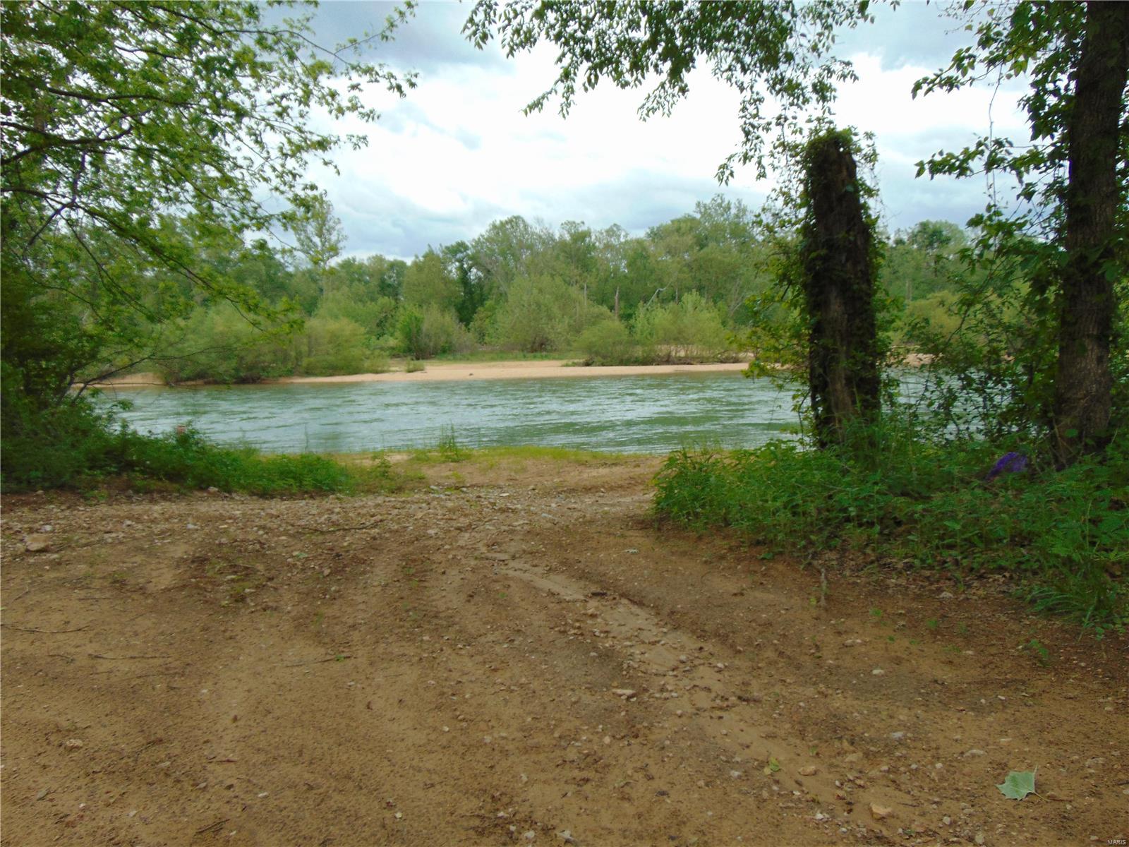 Access to beautiful Current River and Pike Creek!!! This listing consists of two lots. One is approximately .36 acres (roughly 50 x 280') and sits on the hill and joins Pike Creek. The other is a larger tract of approximately 1.26 acres (roughly 200 x 233) that is perfect for RV hook ups. Current River is just 100 yards away and there is a common area for landowners in this subdivision. As land on Current River gets tougher and tougher to find, take a good look at this one. (These tracts are Parcels 1 and 3 of Lot 2 in Pike Creek Estates.)