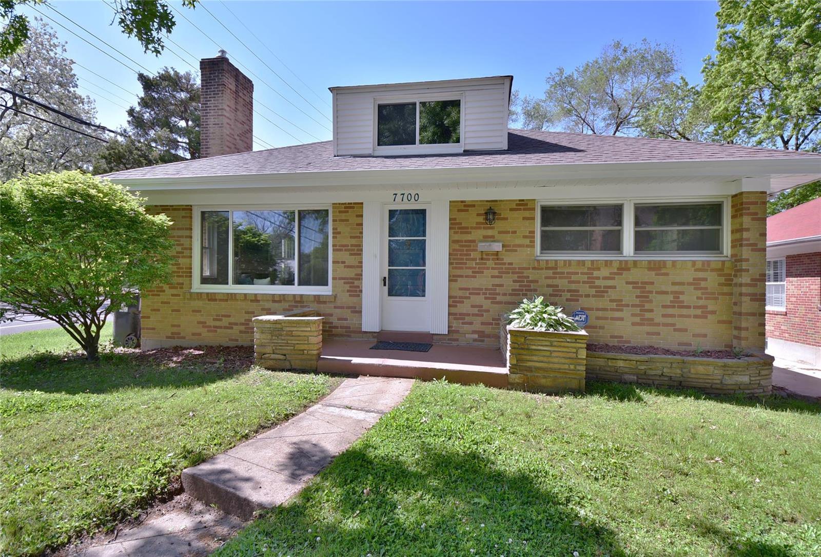 .Move-in ready! Fall in love! Sq ftg is just Main level.   Add 1200 sq ft for finished Lower Level. Basement walk-out, full ba, large family and Rec rooms, dbl sinks, w/d, a/c and furnace installed in 2013! Water heater 2016. Plenty of storage! Kitchen completely updated with new appliances, flooring and granite counter tops. Open floor plan, gleaming wood floors, lots of closets and cabinet space. Sellers enlarged and renovated the Main-level bathroom. Everything is new! An interesting pocket door to bedroom closet - don't you love those?!! Spend romantic or cozy-warm winter evenings in front of the beautiful wood burning fireplace. Seller has completed the U City Inspection - everything is finished and ready for you to pick up the occupancy permit. Corner lot and off-street parking. The sun-room provides a convenient gathering place! Great for entertaining, or a place to bring the guests inside if it is too hot or raining on your afternoon barbecue! a/c and furnace installed in 2013. Additional Rooms: Sun Room