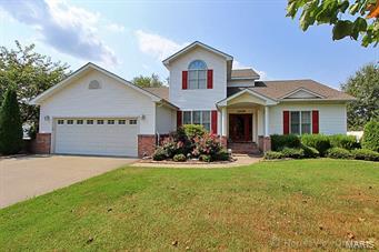 Hardwood flooring and ceramic tile on main level.  Ready to move in with master bedroom on main level.  The family room upstairs can be a 4th bedroom.  Shop in back.  Large deck and storage area in attic.  Priced below July 2015 appraisal.    Call office for code to lock box.
