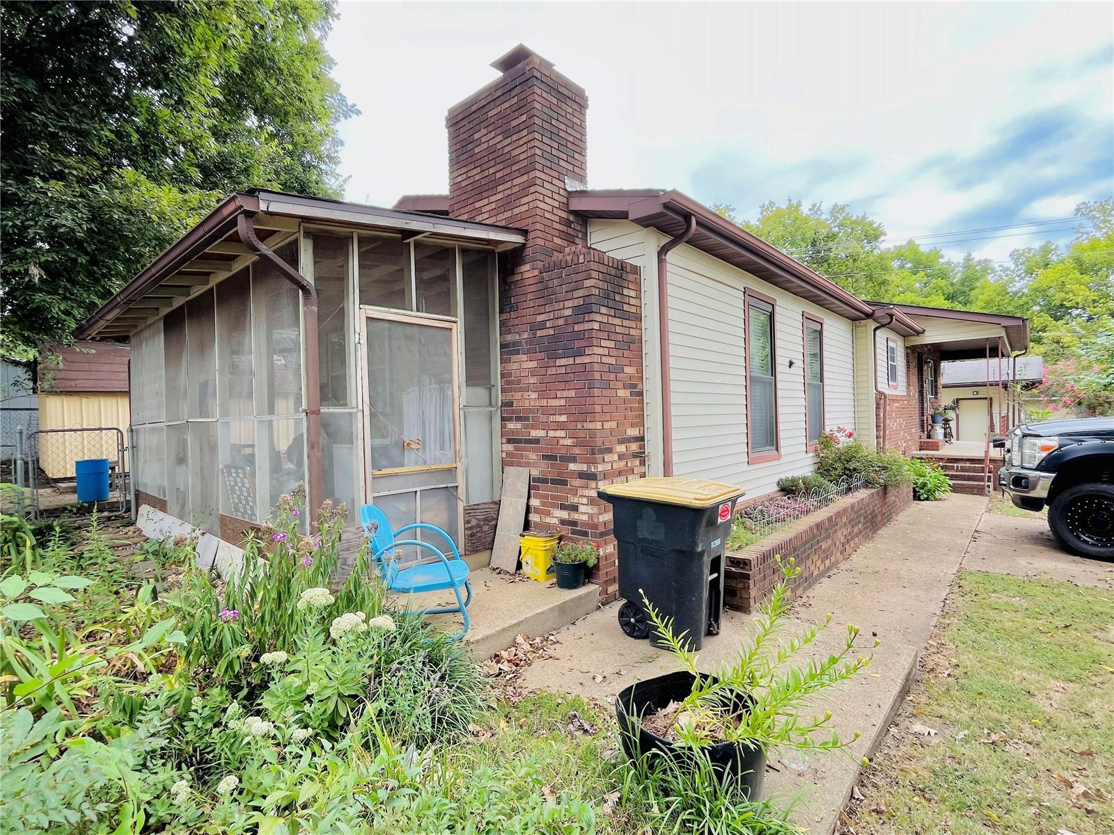 GREAT LOCATION on quiet street, within walking distance to downtown and the Current River! This classic 3 BR/1.5 BA home has so much character and charm! Recently replaced roof and HVAC, new carpeting, so this one is ready to go! This home boasts a large living room, eat-in kitchen, warming room with brick fireplace, three sizeable bedrooms with a bath and a half! You'll love watching the squirrels play as you sit on your front porch or maybe a cup of coffee in the additional quiet screened in porch! Quality built in 1974, they don't build homes like this today! The fenced back yard is perfect for the kids or the pets. Don't' wait to call and set up a private showing! You're sure to fall in love with this one in a price range that many can afford! That said, this one won't last long! Suitable for Bed/Brk