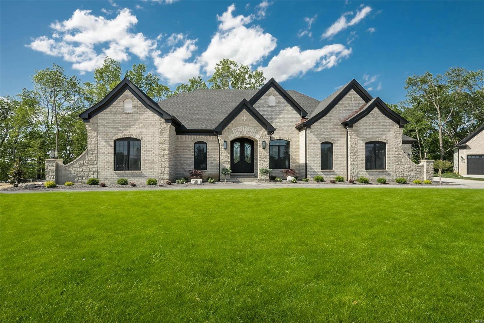 New Construction, Chesterfield, Rockwood Schools! Built by one of St. Louis' premier hands on builders Claymont Development, LLC - Wesley Byrne. The EXCEPTIONAL “ENCLAVE” ranch is a 3 bed, 3.5 bath home of approximately 4,500 sq ft w/ 4 car courtyard garage. Hand forged wrought iron entry door leads to the foyer w/ 12' ceiling; flanked by formal dining room & office/den. Great room features 12’ ceiling, wall of windows & fireplace paired w/ cabinetry & bookcases. Vaulted hearth room w/ floor to ceiling Masonry fireplace open to the gourmet kitchen w/ HUGE island, all SS appliances, & gorgeous custom cabinetry. Coffered ceiling in Owner’s Suite. Unique brick & stone covered patio. LL includes a spacious rec room, custom brick & stone wet bar, 3rd bed & bath. Amenities include: onsite pickle-ball court, walking trail, common ground, & gazebo, perfect for hosting events & socializing w/ neighbors. 4 models to chose from! Tour is of the Display Home
