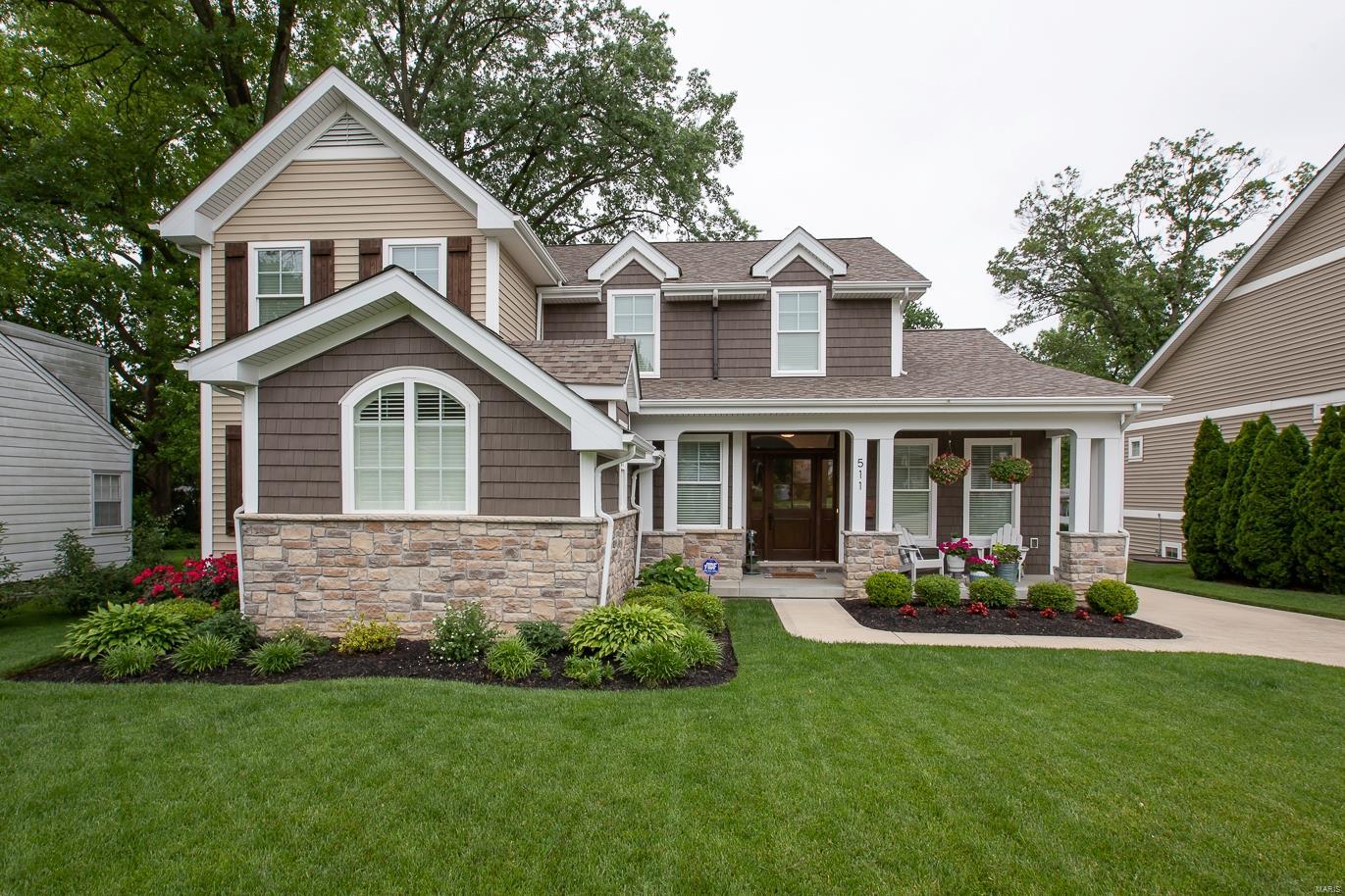 Charming Craftsman Style 1.5-Story Home, built by Scharf Custom Homes, situated on .24 acre level lot, within a cul-de-sac street in the heart of Kirkwood! This 5 Bd, 4.5 Bth, showplace has 4100+ Sqft of living space, terrific open floorplan & high-end finishes - move-in ready! Main Floor features formal Dining & Living Rms, gorgeous Great Rm, incredible eat-in Kitchen/Breakfast Rm, lovely Powder Rm & wonderful Laundry/Mudroom; plus a Main Floor Master Retreat & luxurious spa-like Bth. Walk up the impressive, open staircase to find 3 Bd w/walk-in closets; 1 Bd has private full Bth & 2 Bds share an adorable Jack & Jill Bth. Highlights: hardwood floors, arched openings, custom moldings/millwork throughout, solid core doors, detached O/S 2-car garage, zoned HVAC, plus alarm & irrigation systems! Deep pour LL w/large Rec Rm, gorgeous wet bar, 5th legal Bd & full Bth. Relax on the covered front porch, or deck & admire mature trees in your private, level backyard! Kirkwood School District!