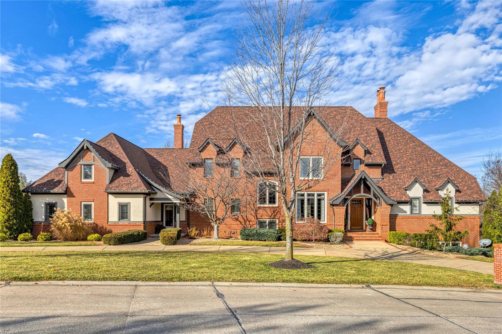This Schaeffer constructed; Dick Busch designed estate home on 1.78 acres in Prestigious WindCastle is enhanced by the finest craftsmanship & meticulous attention to detail. Gracious entry foyer leads to grand room with dramatic vaulted ceilings highlighted by wood beams, masonry fireplace & floor to ceiling windows with transoms. French doors open to handsome library with built-in bookcases. State-of-the-art kitchen with custom buff cabinetry, granite countertops, professional quality appliances and large center island adjoins breakfast room and hearth room with stone fireplace accented by built in bookcases. Primary bedroom offers an appealing retreat featuring, marble bath and access to private deck. Second floor features 3 additional bedroom suites. Walk out Lower Level with billiard room, recreation room with gas fireplace, fitness studio, 1,000 bottle wine cellar, 5th bedroom & full bath. Professionally landscaped grounds include 2 patios, screened-in-porch, & 4-car garage. Additional Rooms: Mud Room