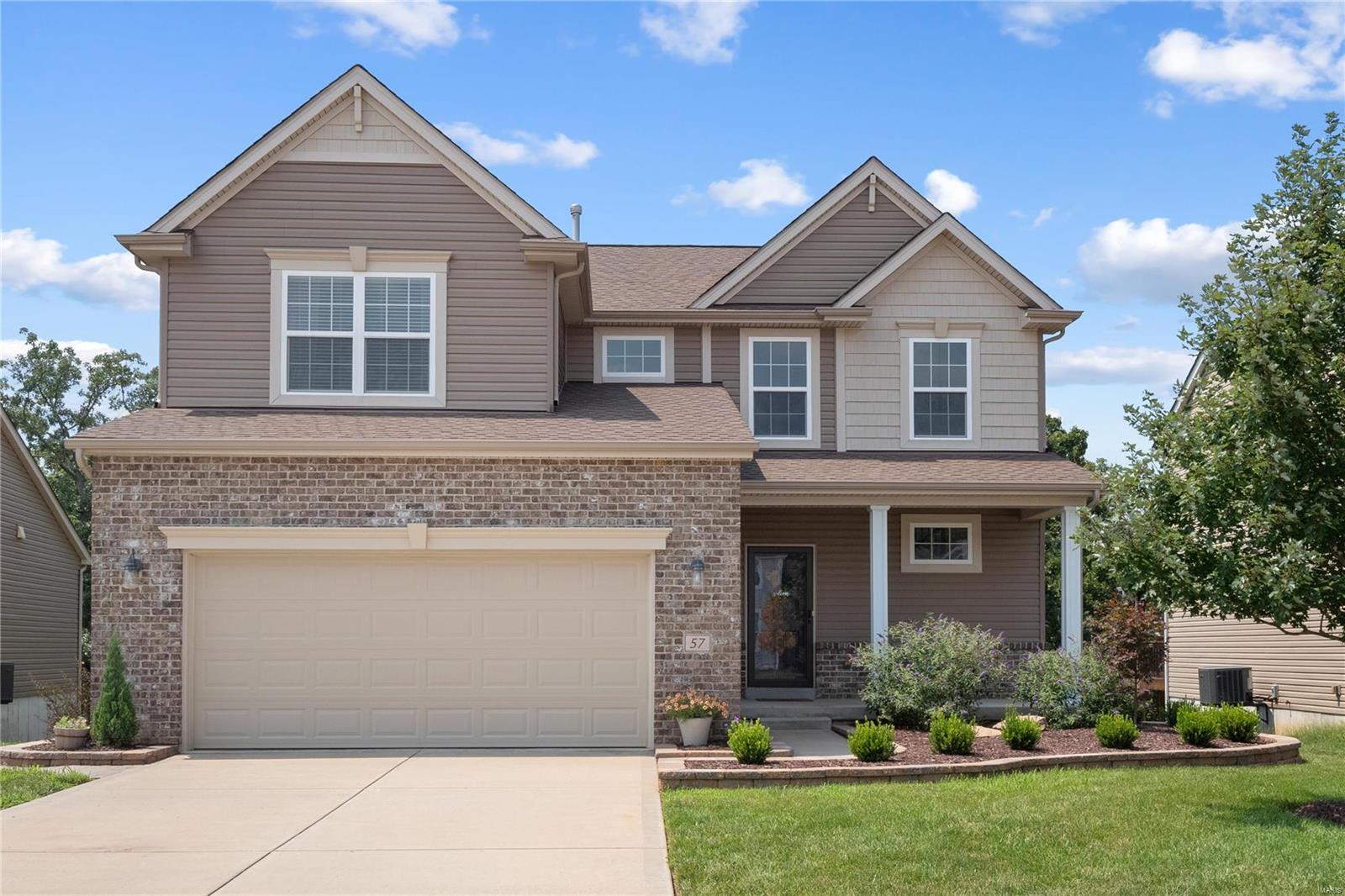 Looking for new construction without the outrageous price tag and long wait? Check out this outstanding 5 year young Payne home! You will absolutely love the inviting open floor plan. Bright white kitchen stuns with granite countertops, center island, and stainless steel appliances that all stay! Flex space on main floor can be used as dining room, office, or playroom. Upstairs features 4 bedrooms, loft space, PLUS 2nd floor laundry for ultimate convenience! Private yard with lovely patio and garden backs to common ground. Walkout basement prepped with bathroom rough-in and tons of storage space awaits your finishing touches! Huntleigh Ridge amenities include community pool, playground, and picnic pavilion. Highly rated Wentzville schools, plus located just minutes from all of the Wentzville Parkway conveniences, this gem won't last long!!