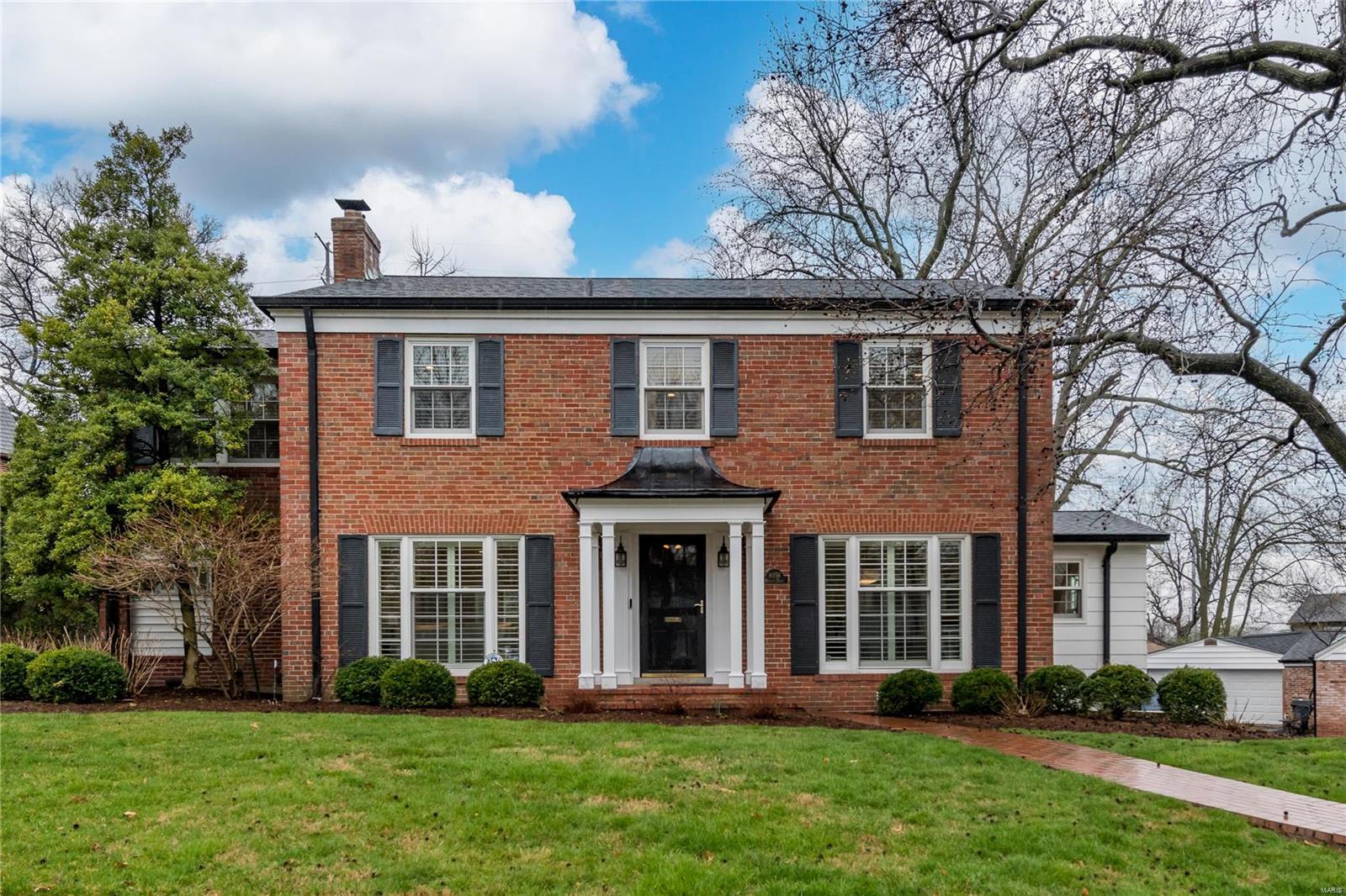Experience the best of Davis Place in this fully renovated home by Markway Construction. Enjoy the convenience of walking all that Clayton offers. This home is bright and modern, featuring oak hardwood floors and a neutral color palette. The expansive living room boasts a fireplace, plantation shutters, and an adjoining den with another fireplace and backyard access. Host guests in the formal dining room or entertain in the spacious kitchen with double ovens, gas stove, center island, custom cabinets with pull-outs, glass-tiled back-splash, and breakfast room with built-ins, buffet, and wine fridge. Step outside to the private, fully-fenced backyard and deck. Upstairs, the primary bedroom suite features a gorgeous bath with dual vanities, under-cabinet lighting, an enclosed water closet, and heated floors. Three additional bedrooms, one with a Murphy bed and an updated bath, complete the second floor. The finished lower level offers a recreation room, full bath, and laundry.