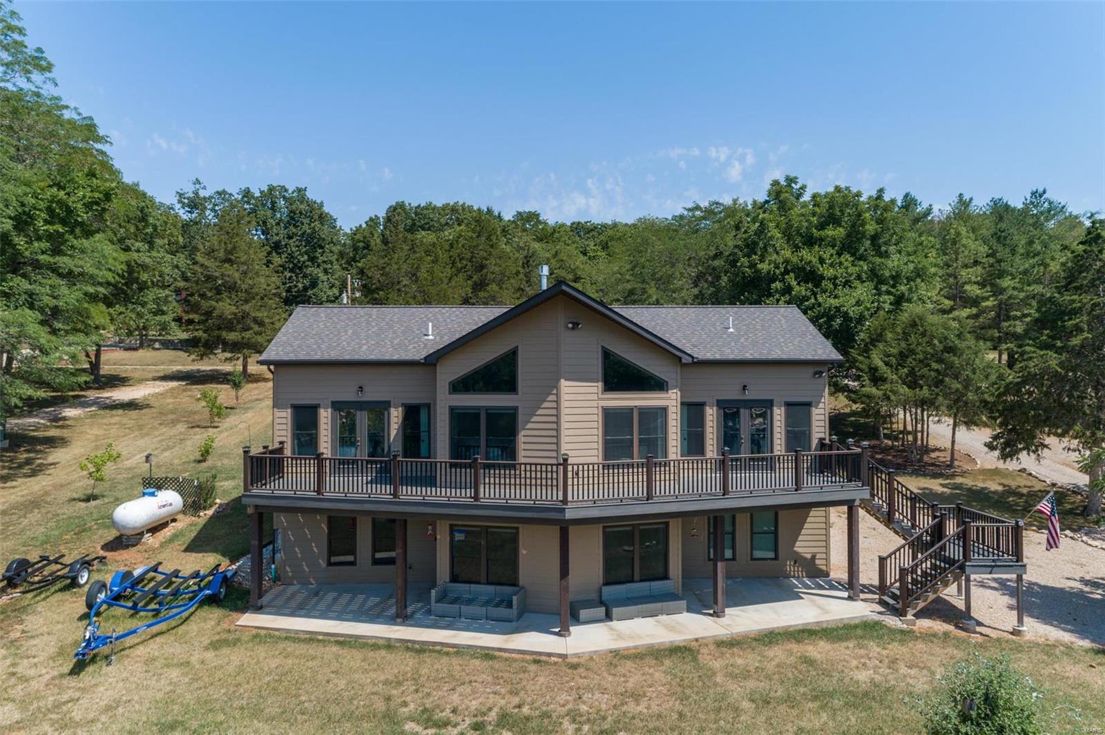 Constructed in 2019 this prime lake property located in Anthonies Mill is the ideal weekend, vacation residence or full time lake living. Panoramic views of Lake Ashley throughout the main and finished lower level. Large eat-in kitchen w/wood cabinetry, pantry, granite counters and stainless appliances. Vaulted great room with fireplace, stone hearth and wood mantle. Double atrium doors to the full length, composite deck. Primary bedroom w/atrium door to deck and double closets. Primary en suite w/dual sink vanity and master shower. Secondary bedroom w/atrium door to deck. Secondary en suite w/dual sink vanity and bathtub. Half bath on main level, wrought iron spindled, open staircase to finished lower level. Recreation room w/lake views, two sleeping areas and full bathroom w/dual sink vanity. Atrium door to lower level patio and walk-out to your private boat dock. Elfa closet systems in each closet and pantry. All appliances stay with home, furnishings negotiable.