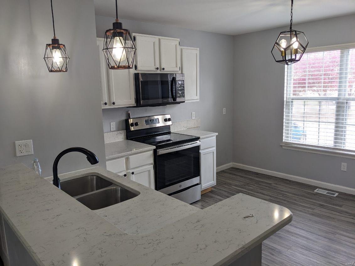 Opportunity Awaits! This beautiful 2 bedroom, full bath with a fantastic large basement with bonus room, storage and convenience of upstairs and downstairs washer and dryer hookups.  Large living room, condo living at its best.  A must see! Vacant for convenient viewing. Additional Rooms: Workshop/Hobby Area Location: Ground Level