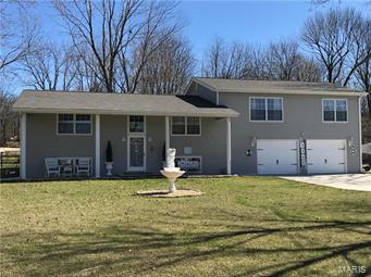 Don't wait...come to the Lake. This beautiful lake house is large and turn-key. It has been lovingly remodeled with lots of updates. 4 bedrooms, two full bathrooms and 2600 square feet. New appliances, light fixtures, updated bathrooms, and painted throughout. Concrete driveway, added insulation and new hot water heater. The location is perfect. 3 level lots with a large back yard, deck and patio, fire pit, shed, basketball court and RV parking. Close to clubhouse, beach and tennis courts. It is the perfect vacation home or full time residence. Don't miss seeing this home...call for an appointment today!