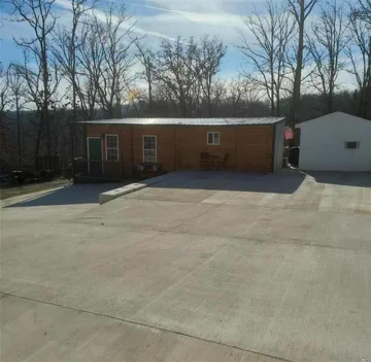 You are going to want to see this TOP Quality built cabin style home in the sought after Goose Creek Lake Community. This listing sits on 2 lots, one of which has a large 30x40 detached shop. The garage is FULLY insulated, heated, concrete floor, large doors (10x10 & 16x10 w/openers) The shop has an additional 8x20 storage room w/built-in shelves, additional bathroom & a climate controlled finished office (8x10-mini split). The property runs from Mohawk Dr to Eades Dr. (Plat 5 Lots 262/garage & 348/house) The owner built/developed this oasis in 2017 & used top quality materials from start to finish on both the building process & finishing touches. The eat-in kitchen has stainless appliances that stay w/sale, very large island & custom cabinets. Home offers tall ceilings, nice bathrooms finish's, zoned heating/cooling, additional bath-house w/laundry (Nice). There is 18x20 covered pavilion next to the firepit area for entertaining & a large deck. 
Pics DO NOT showcase proper-Must See!!