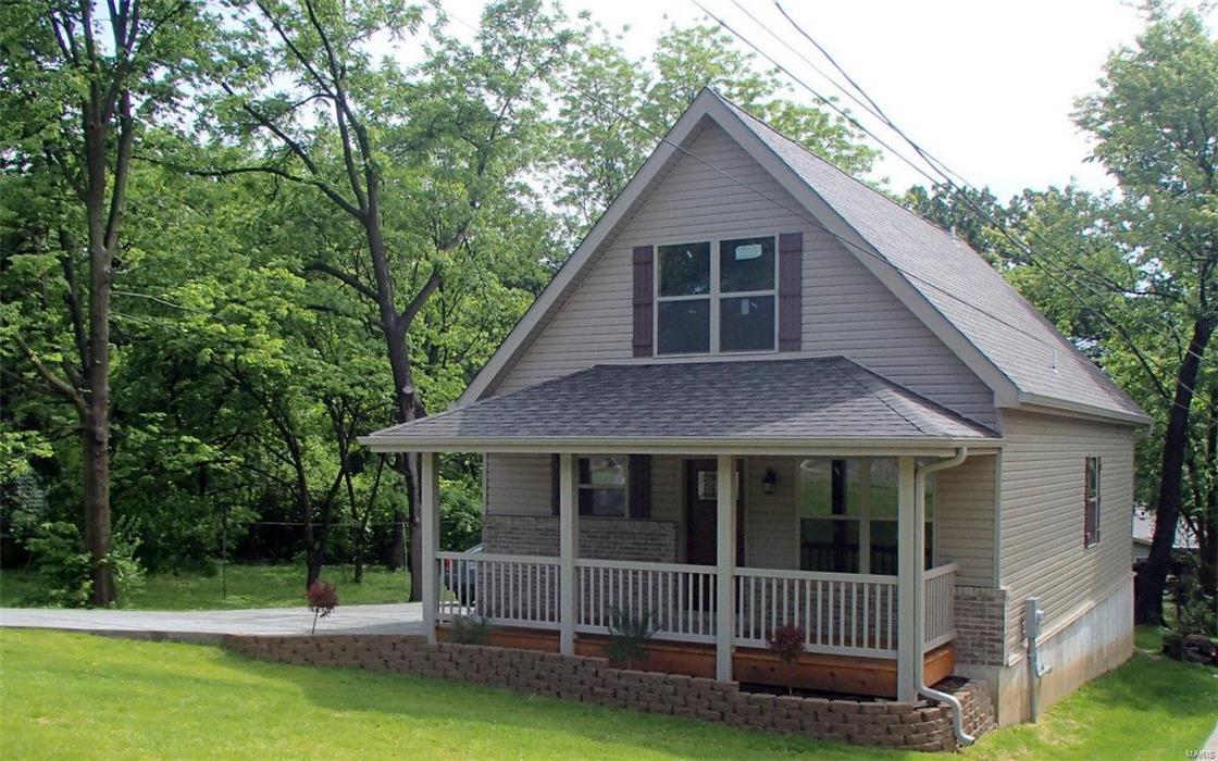 Like buying a new home! This 3 bedroom, 2 bath gem has been completely renovated and rehabbed. Features higher than normal ceilings through out the main level with stylish hardwood flooring, 30 year architectural roof, completely updated HVAC, 200 Amp electric service panel, more than adequate off street parking for owner and their guests. Fully equipped kitchen with granite countertops, stainless steel appliances which include dishwasher, electric stove/range, microwave, disposal and refrigerator. Main floor laundry. Upper level master suite features huge shower & separate claw foot tub, double bowl vanity, & nice sized walk in closet. Maintenance free vinyl siding, enclosed soffits & fascia with some decorative brick work at front of home. Covered porch measures 21 ft by 6 ft and runs the full width of the home. Wooden deck at rear of home with stair system leading to concrete drive and back yard.  2nd laundry hook-up is in LL if one wishes to utilize main floor laundry as closet.