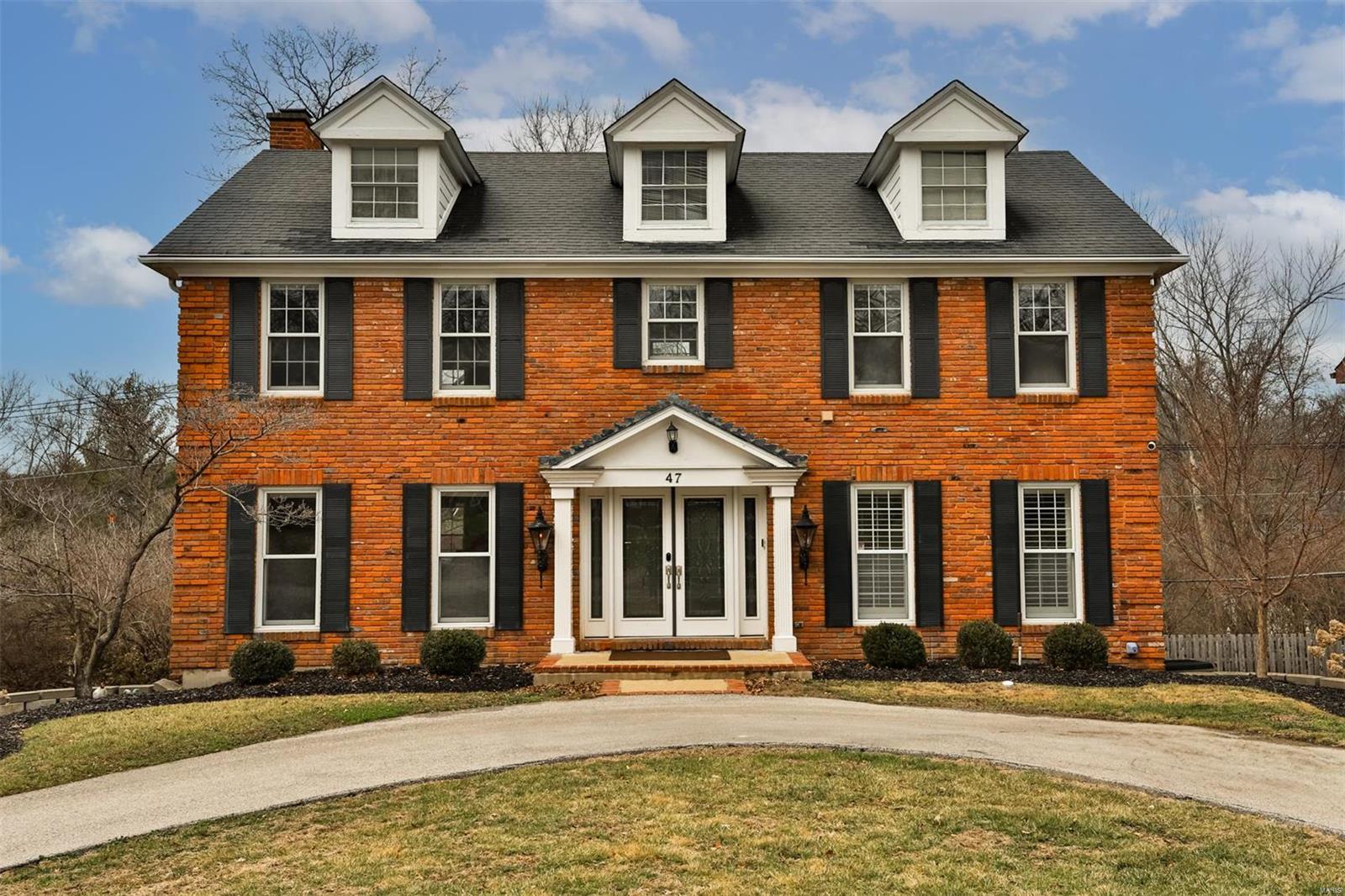 Tucked away at the end of a quiet cul-de-sac in the sought-after La Hacienda neighborhood, this stunning brick two-story is the perfect blend of charm & modern comfort. With over 3,000 sqft of living space, this home is designed for both everyday living & effortless entertaining. The light-filled center hall plan welcomes you w/ beautiful hardwood floors, leading to elegant living & dining rooms. The cozy family room, w/ its rich woodwork & gas fireplace, flows seamlessly into the beautiful kitchen featuring timeless white cabinetry, SS appliances & a butcher block island. Step outside to a deck, perfect for summer gatherings. Upstairs, the spacious primary suite offers a peaceful retreat with a sitting area, walk-in closet & a spa-like bath. Two additional bedrooms, each w/ private baths & a second-floor laundry add convenience. The walkout lower level offers a fourth bedroom & full bath, ideal as a guest suite, office, or rec room. Outside, enjoy a shaded patio & level backyard!