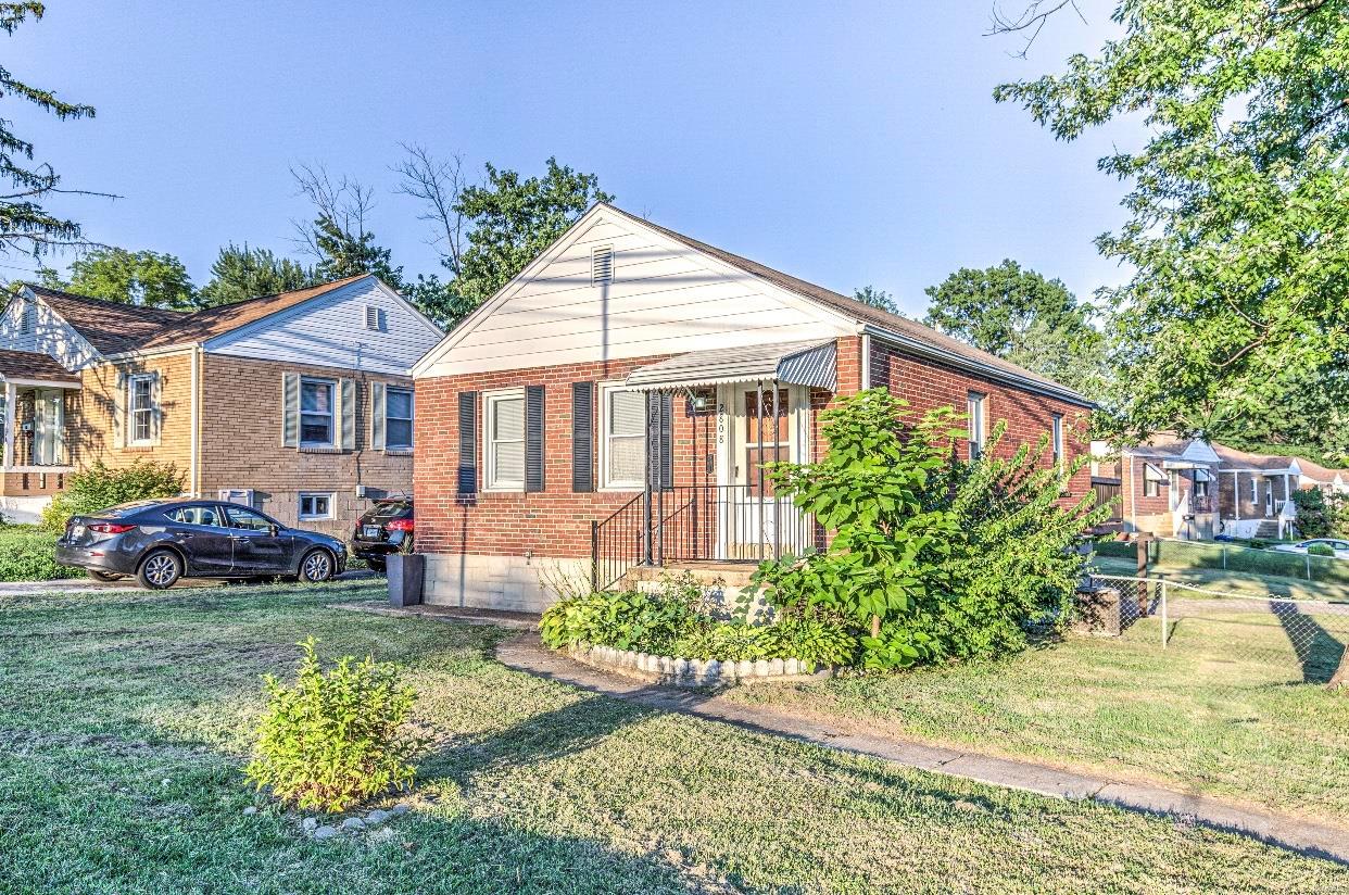 Adorable bungalow features 2 bedrooms 1 bathroom. Home features a new kitchen with a granite countertop. Partially finished basement with recreational area, laundry space, attached garage and MORE!!! It is a fenced corner lot, and close to all of South County's many amenities! Beautiful hardwood floors, and amazing covered patio in the back with a fenced yard. Also potentially one bedroom in the basement