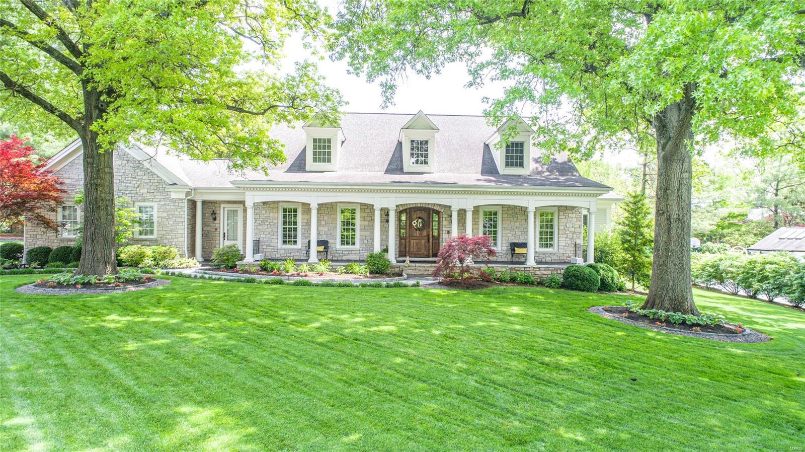 Storybook Cape Cod, nestled on private, level lot in the heart of Ladue. Charming culdesac lane accross from St. Louis Country Club and just a short 2 minute drive to Clayton. Predominately stone. Gorgeous rear yard backing to trees with 5 year old pool by Pool Specialists. Covered octagon sitting area with TV. Outdoor firepit. Covered patio area spans across the rear of the home with bead board ceiling. Inside the outstanding floor plan has great usable space in all the right locations. Beautiful kitchen is the center point with center island/breakfast bar that leads to huge hearth room on one side and large breakfast room on the other.  Dining room with french doors to pool area. Master suite with large bath and customized walk in closet. Upstairs there are 3 bedrooms and bonus room, 2 full baths. LL has a large family room, billiard area, exercise, office and wet bar with dishwasher and frig, 3 car garage with stairs to open attic space. Hickory floors beautiful beams and millwork.