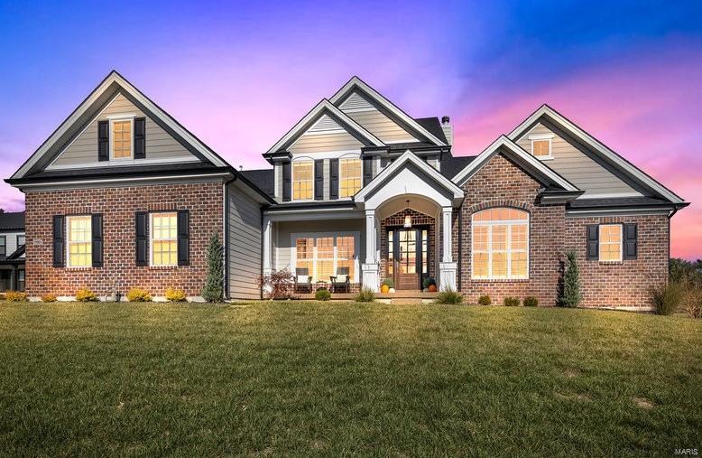 Welcome to 17003 Waterside Hts, a luxury location on a premium lot in the prestigious Fienup Farms. As you enter this stunning, 4164 sq ft home, you will notice high quality materials and many upgrades throughout. The soaring ceiling height in the great room will give a grand feeling to the breathtaking, panoramic view of the lake.The kitchen includes custom cabinets, granite countertops, Wolf appliances and built-in speakers. Off the kitchen is a sun room with lake views. Don't forget to make note of the 400+ sq ft bonus room above the garage which could be used for an office, playroom etc. Once entering the unfinished LL, you will see it is ready for your personalized touch. This custom home boasts one of a kind features and a custom walk out basement that is steps away from the lake. Within this community, you have walking trails, playgrounds, kayaking, pickleball & fire pits for the upcoming chilly weather. A superb location minutes away from downtown Chesterfield. Additional Rooms: Sun Room
