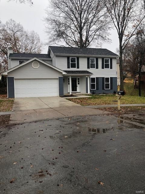 Welcome to 160 Holly Green Dr located in desirable Ballwin, MO! This home has been completely renovated and is ready for new owners! As you walk through the new front door you will immediately notice the new 3/4in hardwood floors that cover the entire main level! Also on the main floor is a living room, dining room, and an entertainers kitchen which is open to the family room with a woodburning fireplace! The kitchen has been upgraded with solid wood cabinets and soft-close hinges, quartz tops, stainless steel appliances, recessed lighting, and center island. Upstairs is the large master suite, 3 additional bedrooms, and a second full bath. Both bathrooms boast new tile surrounds and tile floors as well as new vanities, onyx tops, and lighting! Other upgrades for this home include new carpet, paint, lighting, and all new windows! Exterior upgrades include new landscaping, a new poured concrete rear patio, and a newly poured driveway! Dont miss out on this incredible home!