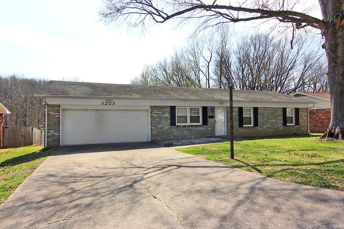 Come take a look at this all brick 2-car garage ranch home, nestled in well-established Chateau Manor subdivision, is waiting for you! Entire home boasts all beautiful hardwood flooring and ceramic tile, no carpeting. Main level has three bedrooms with 2 baths and generous closets. Kitchen/dining combo with beautiful Liley granite countertops. Enjoy watching wildlife from a large deck that overlooks the fenced back yard. Downstairs is a walk out with all ceramic tile, a sleeping room/office space, large utility room with w/d hookups and additional closets and storage space. A large 13 x 42 area is just waiting to become a family room, game room or entertainment area. All of this plus another bathroom! There is a 10 x 13 building in the backyard with concrete floor and electricity perfect for a shop or she-shed. Additional w/d hookups in garage. Piano in basement stays as well as concrete birdbath and bench in back yard. Home is being sold AS-IS, call for your viewing today!