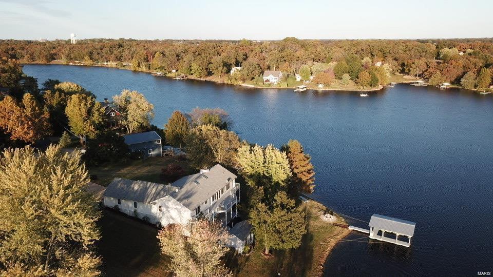 Recipe for Relaxation: Combine one part comfortable large deck with one part boat dock, mix with a gorgeous lake view and add ice tea. You're ready to enjoy this five bedroom treasure. Are you ready to relax in this lake front home?

238 feet of lake frontage (2 lots)!

Home features an oversized insulated 4 car garage, 2 kitchens, 2 laundry rooms, 2 decks, and 2 fireplaces! Approximately 10 ft ceilings in the lower level.

Seller would consider a Triple Net Lease with Option to Purchase with the following: 
$12,000 option fee
$3,000/monthly payment

Real Estate Broker is member of Owner LLC.