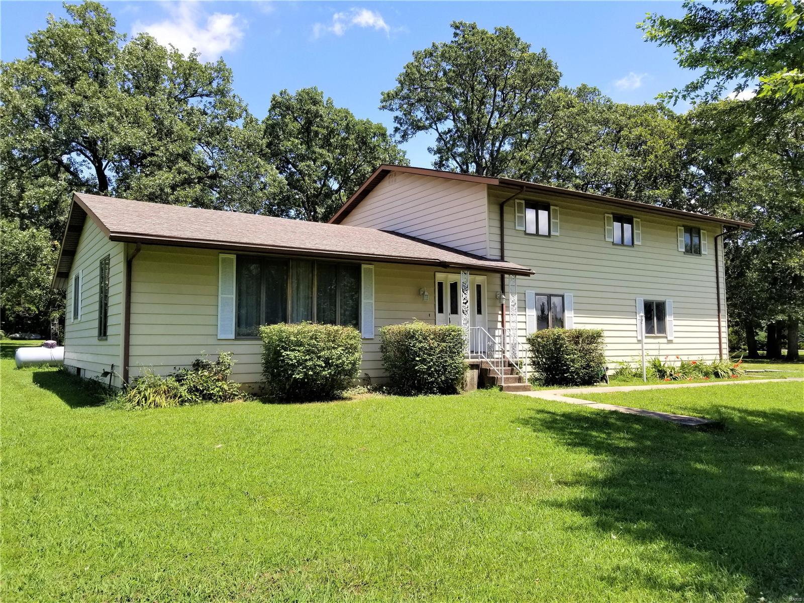 This big beautiful home is a must see!! This four bedroom, two and a half bath home is located just minutes outside of Lebanon on a mostly level 1.21 (m/l) acre corner lot. On the main floor you will find a spacious living room that opens to the large dining area. Just off the dining room you'll find the kitchen with tons of cabinet space and a large island with access to the homes screened in back porch. Step down to the lower level you will find an open entryway leading to the massive lower level bedroom, access to the double car garage and a half bath. The upper floor contains a large bathroom with laundry, the master suite with huge walk in closet, a nice office area and two more large bedrooms with good size closets. This home is less than five minutes to the golf course and Dollar General and less than fifteen minutes from Bennett Springs. Additional Rooms: Sun Room