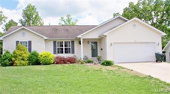What a jewel! Move in ready. Beautiful new flooring installed 1 yr. ago in living, dining and master bedroom.  Open living floor plan with vaulted ceiling and accent shelves. Separate bedroom plan.  The deck in back is huge, freshly stained and awesome. Amish built utility shed stays. Quite neighborhood. A must see.