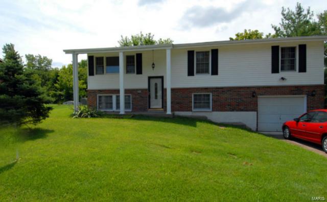 3 bedroom 2 bath home with oversized garage (25x16).The kitchen/breakfast room has lots of cabinets & counter space. A door leads from the breakfast area to large covered deck overlooking the 1/3 acre fenced lot with mature trees & flowering perennials. The lower level features a 24x12 family room & a large unfinished room for storage with washer and Dryer hook ups. Hardwood floors in the living room, hall and bedrooms, laminate floor in kitchen/breakfast areas. Walkout basement. Fridge and stove included. 1144 sq ft, but that's not counting the lower level family room. Security deposit is $1075.00. One year lease minimum. Available for occupancy immediately. All utilities are at tenant expense including sewer, water and trash. Pets are negotiable with possible pet deposit, depending on number and size of pet(s). This home is strictly for rent and is not available for lease purchase or option to buy.