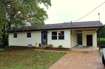 USDA eligible 100% financing! Move in ready home. This ranch home is sure to please with a large level lot size of almost an half acre (.42) that backs to trees with fencing in the back yard.  Sit on your back deck & enjoy the wild life & BBQ's with friends & family. 
This home features a open floor plan with a large living room & kitchen/combo dining area. Main level has 2 bedrooms & 1 full bath. Master bedroom may be converted to be a 3 bedroom home if needed. Lower level contains an area that may be an office or sleeping area. Lower level also has plenty of space for a game room or living room! 
You will have plenty of parking space when friends &  family visit with a carport & an extra parking pad. So many possibilities with this home. Schedule you showing ASAP before it is gone!