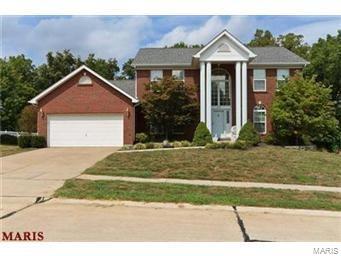 Stunning 1.5 story with a very nice backyard .almost a half acre. Main floor master suite with luxury bath with ceramic tile , dual vanities, separate tub and shower & a walk in closet.. Gorgeous two story windows with a lovely view of the trees. 2stry entry with hardwood floors. Large formal dining room. Beautiful vaulted kitchen with custom cabinets, center island, built in planning desk and wood floors. . Main floor laundry. Wood burning fireplace. Two wall alcoves, plant shelves, six panel doors.Three spacious bedrooms and a sitting area on the upper level. Finished walkout lower level with rec room/ media room, bedroom  large full bath and an office with built in book shelves. Huge patio and large deck. Full brick front. One of the best lots in the subdivision. Huge private backyard with trees.