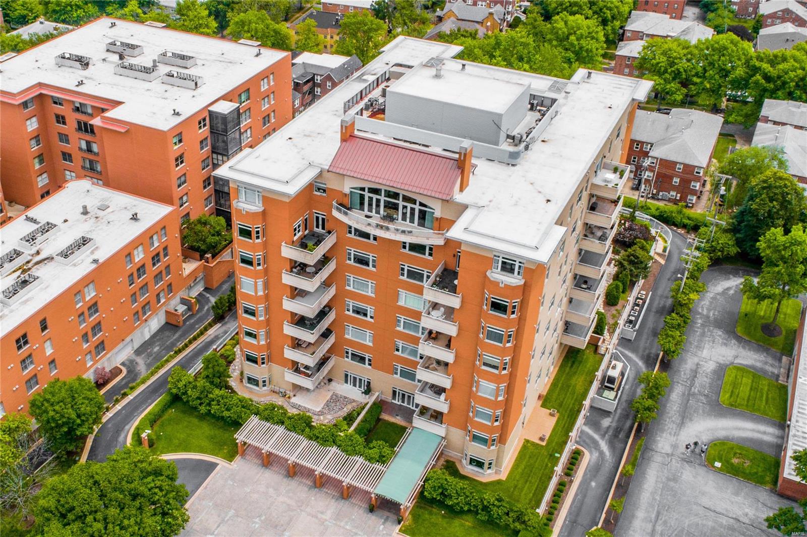 This elegant townhouse condo is in one of the finest full-service buildings in Clayton. The property was completed for the owners by combining the 4th and 5th floor units into one 2-level unit. Private, interior elevator in the unit. The design makes great use of the space, providing a nice flow on the 1st floor for entertaining, while giving privacy to the 2 well separated bedrooms upstairs. Neutral white kitchen with a center island & adjacent wet bar opens a family room. Off of the dining room is 1000-bottle wine room. The living room has a gas fireplace & an expanse of windows and door to a large terrace. The 2nd floor has a 2 bedroom suites & a laundry room. The master suite includes a bathroom with double sinks, separate shower & an air-driven jacuzzi tub, expansive master closet & a 2nd terrace. 3 garage spaces and 2 storage lockers. Building amenities include: 24-hour doorman, heated pool, exercise room, party room & 3 guest suites. Location: City
