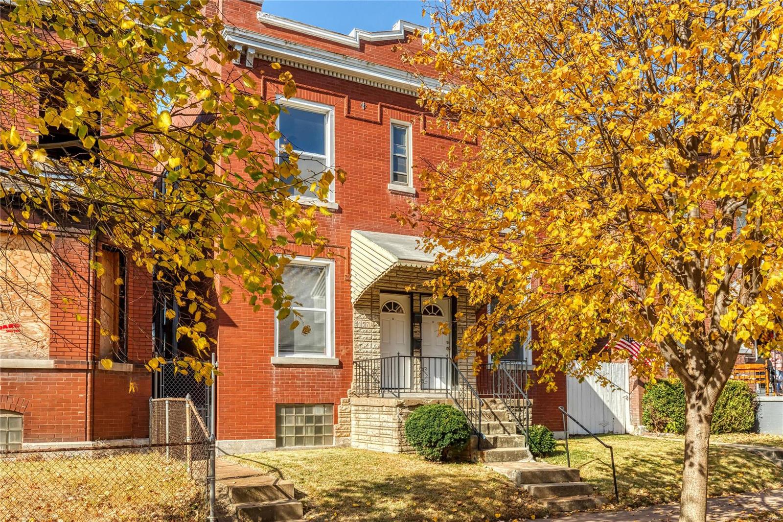 Updated 2 family townhouse located just minutes from Cherokee street. Each unit features two spacious bedrooms sharing an updated full bath, large sunny living room, and eat in kitchen with ceramic tile flooring, gas stove, & refrigerator. Gleaming wood floors, fresh neutral paint, spacious closets, and beautiful arched doorways are just a few of its charming features. Other amenities include a full, dry, basement with two laundry hookups, spacious fenced in yard great for pets and kids, detached garage, new water heaters (2017), new thermostats (2017), new window AC units (2019), and newly resealed roof (2019). All appliances stay! LOCATION! Townhouse is located on the same corner as Froebel Elementary and is just a short walk to popular restaurants & shopping. You do not want to miss out on this amazing investment!!
