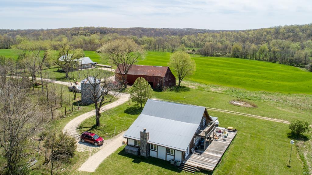 These incredible 98.2 surveyed acres in Gasconade County are officially available for purchase! With 2 log homes and 3/4 mile of Bourbeuse River Frontage, this property will take your breath away!

The first cabin you pull up to is a 2 bed, 2 full baths with a beautiful, vaulted ceiling in the dining room and kitchen. The upstairs sleeping loft bedroom has a second-floor balcony/porch overlooking the entrance to the farm and the big tillable field. This cabin is equipped with a refrigerator, stove, microwave, dishwasher, clothes washer, clothes dryer, and trash compactor all of which will transfer to the new owner.

The big log home has a second full floor upstairs and is a 3 bed, 4 full bath log cabin that was moved from Leslie, Missouri in 2006!  This home is also equipped with a refrigerator, stove, microwave, dishwasher, clothes washer, clothes dryer, and trash compactor all of which will transfer to the new owner.

This property will not dissapoint!