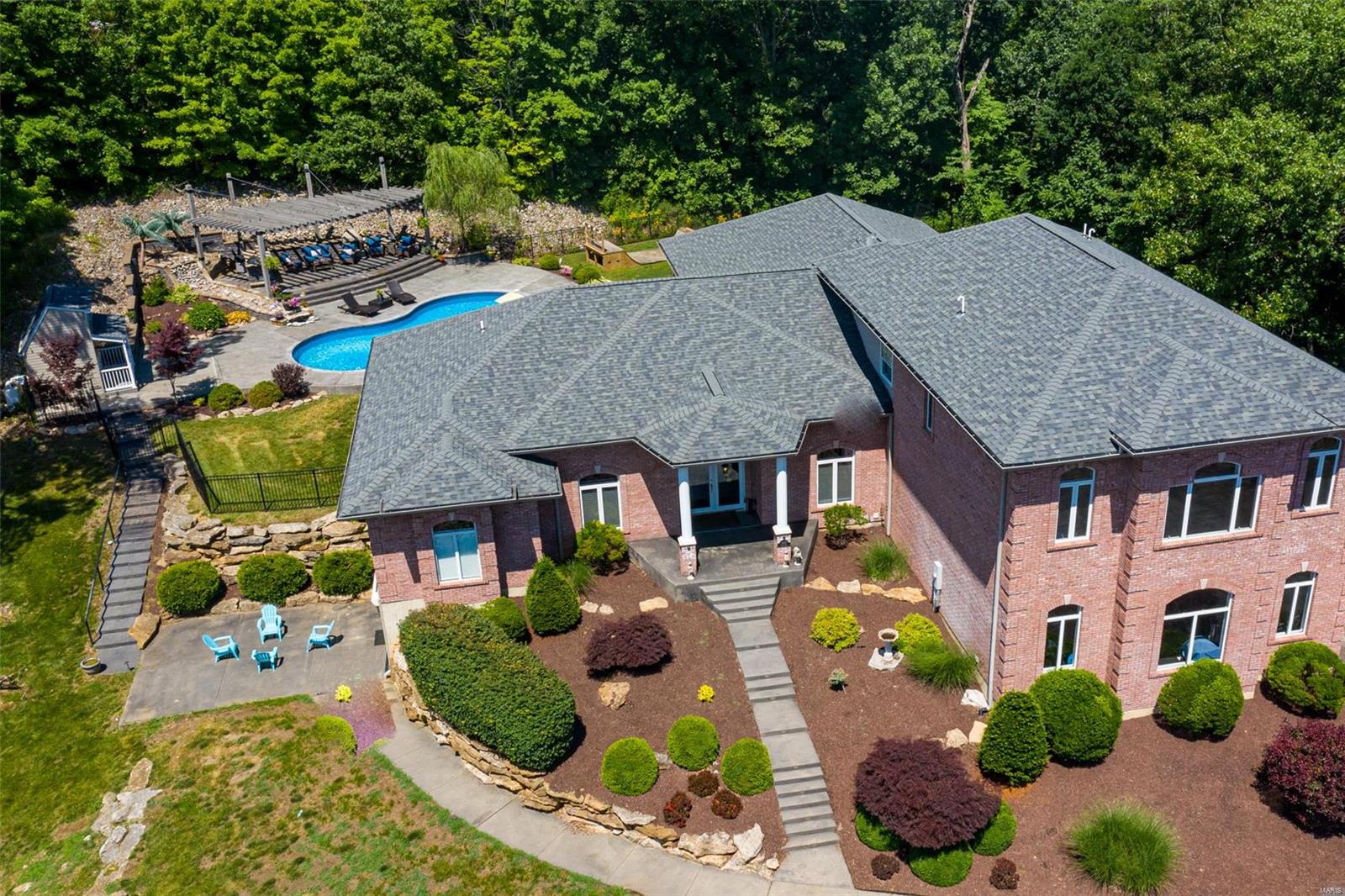 THE PERFECT HOME FOR ENTERTAINING! Your private getaway is 8 min from Hwy 44 & Hwy 109. A little slice of heaven w almost 8000 sq ft of Custom home built living space & 3 acres of outdoor private space to enjoy. 6 BEDS, 7BATH, & 4 CAR garage. Replacement cost is 1.2  mil in todays market. Special feature includes separate apartment that could accommodate an older child or mother in laws quarters w Family rm, full kitchen, bedrm, full & half bath and spectacular views. Amazing outdoor entertaining area w inground pool, patio w pergola, fireplace & outdoor kitchen.  Rockwood schools & Jefferson County taxes. Lower level finished w commercial bar, family rm, bath and extra beds. Laundry area on all 3 levels. Main kitchen is made for a gourmet chef with plenty of cabinets, granite counters, copper sink. Main floor master suite with luxury bath w whirlpool tub & shower. Possibilities are endless w 3 levels of living space. MULTI-GENERATIONAL HOME! Roof 2018, sprinkler, intercom as well.