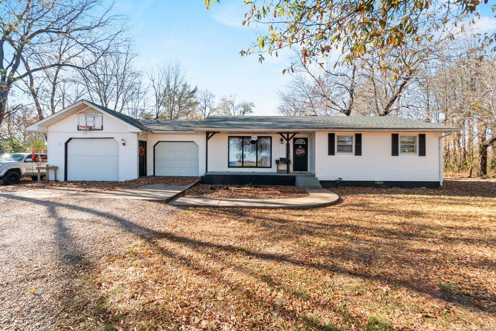 This is your slice of country heaven! Located just outside of Advance, but with country views. This spacious home will give your family plenty of room to enjoy! Inside the extra large kitchen and family room are perfect for entertaining! The wood burning fireplace and floor to ceiling windows create the ideal space to get cozy this winter! 
The master bedroom has tons of floor space and natural light. And the adorable custom headboard can stay!! 
Outside will make any child happy to call this their home! From a pond to fish in, a fun treehouse and extra woods to explore, they won’t want to come inside!